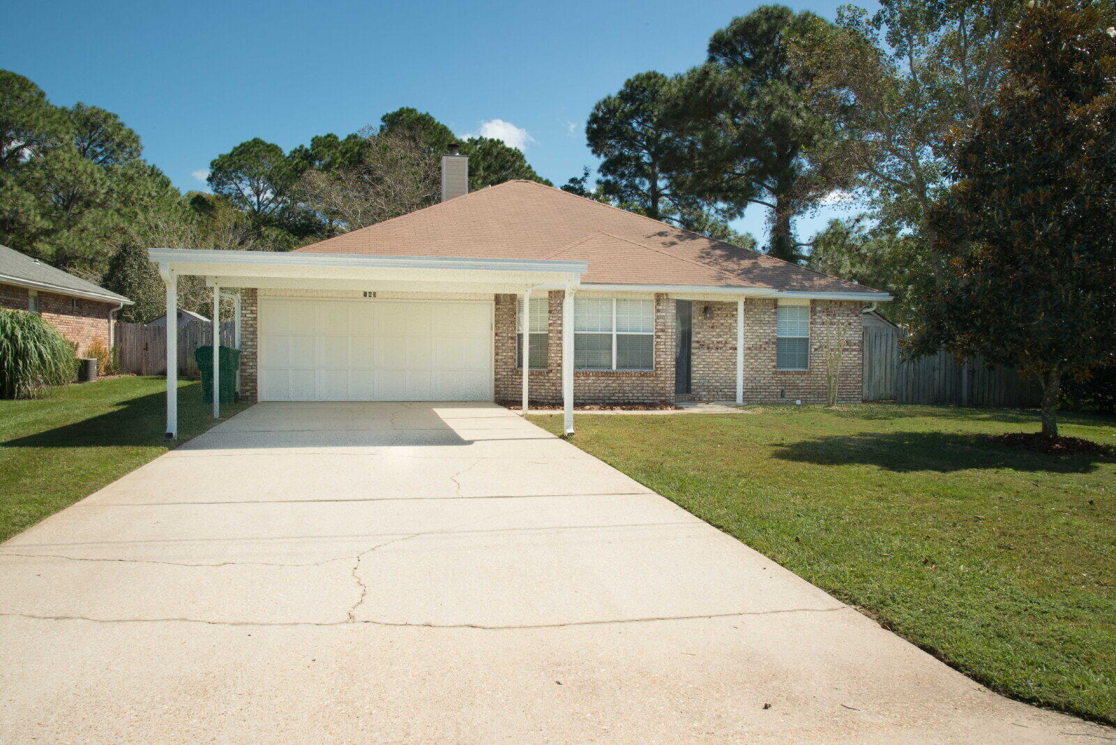 This spacious home offers convenient access to Hurlburt Field and features an open, functional layout ideal for comfortable living. The kitchen is equipped with ample counter space, a breakfast bar, and flows seamlessly into the dining area. A skylight and large window allow the space to have natural light, creating a warm and welcoming atmosphere. The generous living room features a cozy corner fireplace and offers plenty of space for both relaxing and entertaining. The master bedroom provides private access to the Florida room. Additional highlights include a large two-car garage and a sizable, privacy-fenced backyard with ample room to enjoy the outdoors. Sorry, no pets allowed. All Coastal Realty Services residents are enrolled in the Resident Benefits Package (RBP) which includes renters insurance, HVAC air filter delivery (for applicable properties) and our best-in-class resident rewards program, and much more! More details upon application.