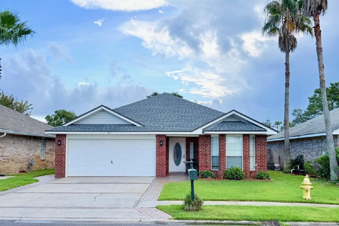 Coastal Living in Paradise Retreat!!
Welcome to this beautifully maintained 3-bedroom, 2-bath all-brick home in the sought-after gated community of Paradise Retreat. Ideally positioned with convenient access from Scenic Gulf Drive on the beach side and Highway 98 to the north, this home places you minutes from the beach, dining, shopping, and local entertainment. Inside, a bright, open floor plan creates an inviting setting for everyday living and entertaining. The recently updated kitchen features granite countertops, a tile backsplash, farmhouse sink, stainless-steel appliances, and a seamless flow into the living room, dining area, and an additional informal sitting space. The desirable split-bedroom layout provides privacy for the primary suite, located on the opposite side of the home from the guest bedrooms. The primary bath includes a separate garden tub, and the suite offers a generous walk-in closet. Outside, enjoy a spacious backyard with ample room to add a pool, plus an inviting paver patio designed for outdoor dining, relaxing, and gathering with family and friends. Approximately 320 feet of deeded beach access is just a short walk away. Whether envisioned as a primary residence, comfortable second home, or short-term rental opportunity, this property offers exceptional flexibility in one of the area's most desirable beachside communities. Estimated short-term rental potential is reported at up to $80,000 annually; buyer should independently verify rental projections and local regulations. Major upgrades include a tankless gas water heater (2018), new dishwasher (2022), new HVAC system (2025), freshly painted interior, a new irrigation pump, metal hurricane shutters, and a new roof (2026). A two-car garage adds everyday convenience and storage.
