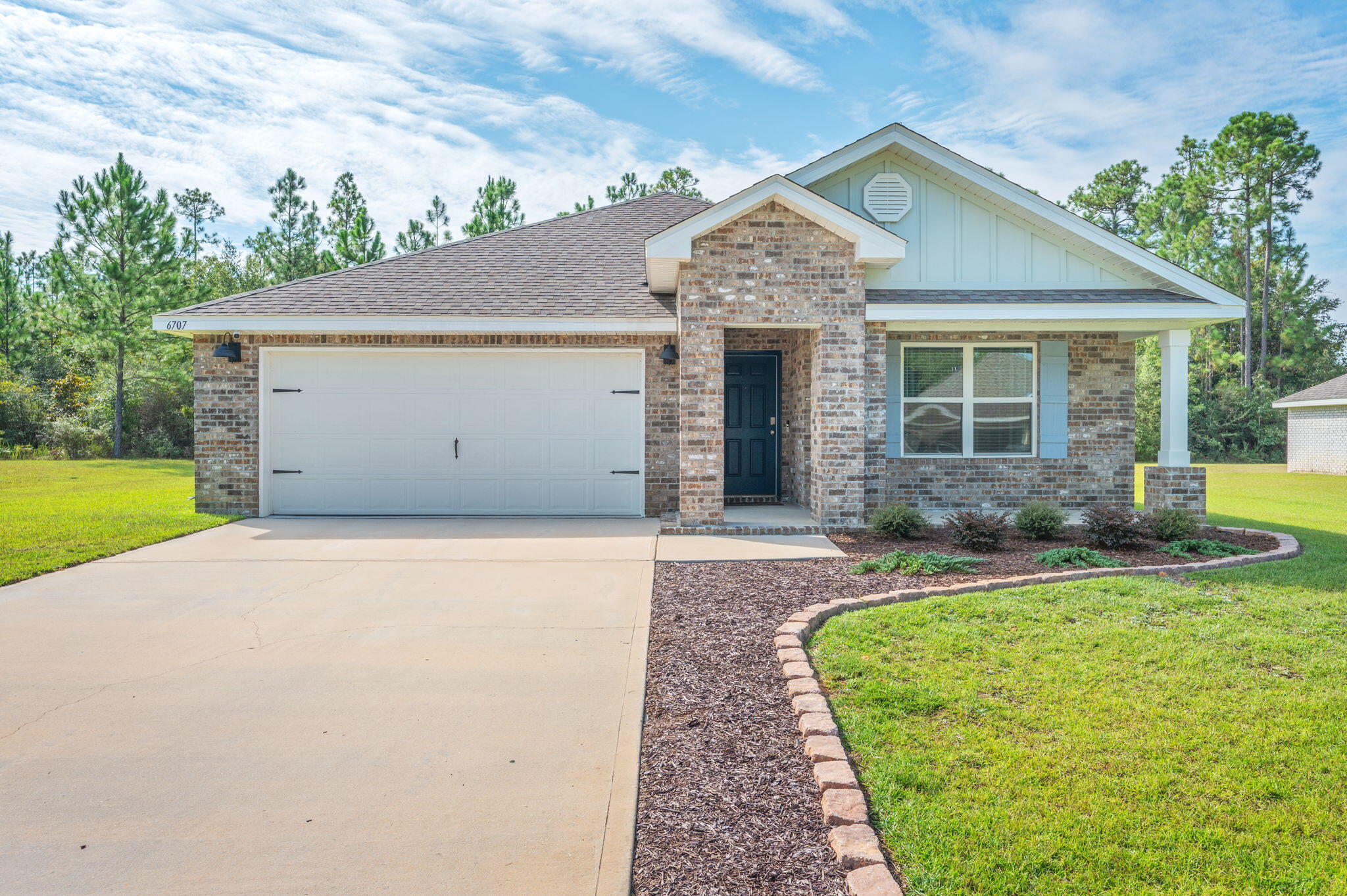 Stop the car and check out this great new listing that it located less than 10 minutes to North Crestview. This lovely 4 bedroom, 2 bath all-brick home built in 2022 is the true definition of Move-In-Ready. From the moment you arrive, you'll notice the beautiful landscaping, spacious .4 acre lot, and charming covered front porch that sets the tone for what's inside. Step through the door and fall in love with the layout, designed for effortless entertaining and everyday living. The bright and spacious living area flows seamlessly into the kitchen and dining space, making this home perfect for gatherings with family and friends. The split-bedroom floor plan provides privacy, with a relaxing primary suite. Three additional bedrooms offer plenty of space for guests, family, or a home office. Seller is offering his new riding lawn mower for easy future lawn maintenance.