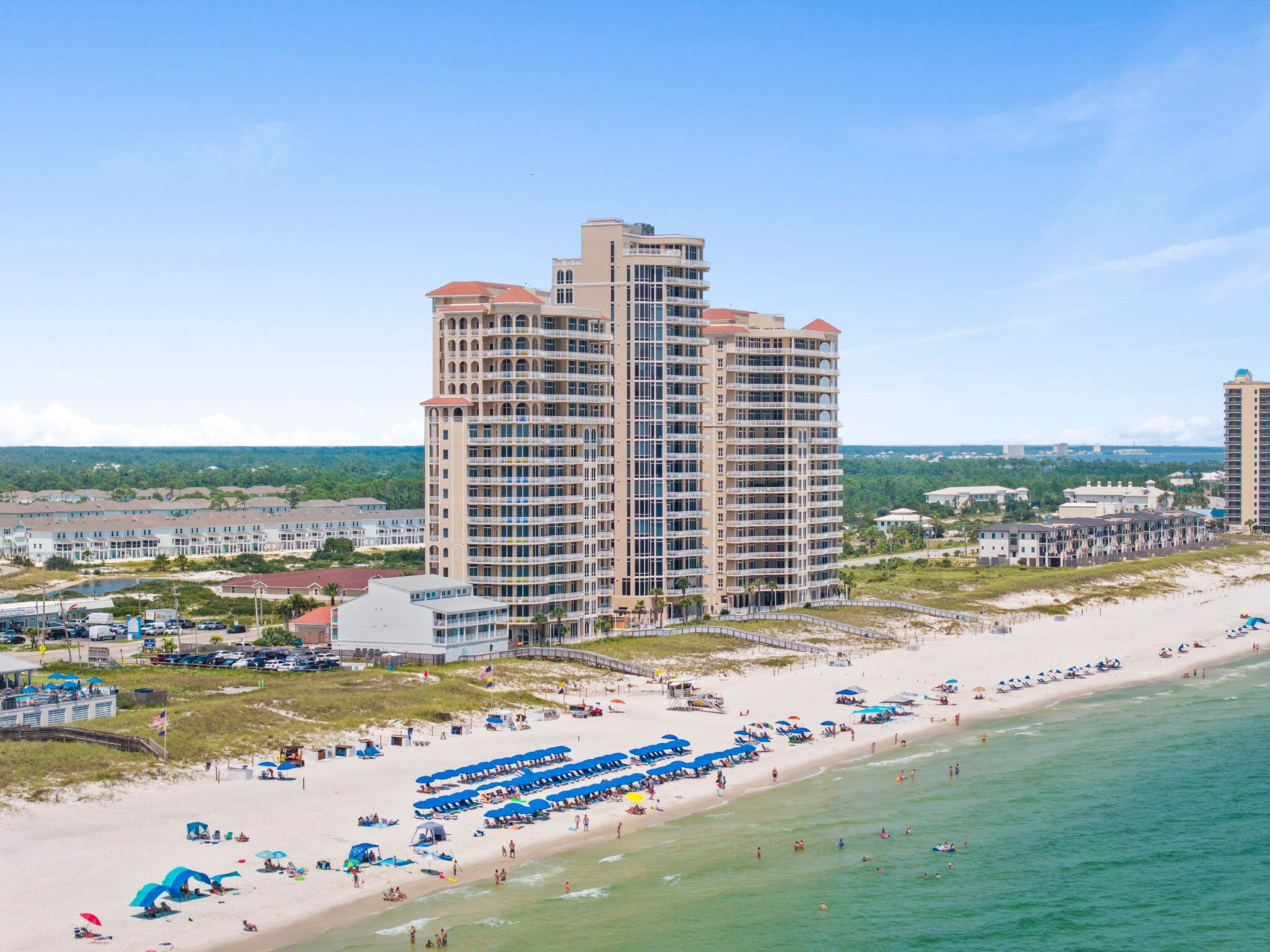 The pinnacle of La Riva West, this rare 16th-floor penthouse commands the building's top floor with approximately 4,868 SF of custom-finished Gulf-front living, over 2,000 SF of balcony areas, exceptional privacy & sweeping panoramic views across the Gulf, beaches & waterways of Perdido Key. Originally owned & occupied by the developer, this one-of-a-kind residence was created with exceptional attention to detail, then impeccably maintained & thoughtfully upgraded while preserving its luxury Mediterranean character. The interior features 4 bedrooms, 4.5 baths, including 2 Gulf-facing primary suites, a private elevator foyer, custom floor plan, plantation shutters, Closets by Design custom closets, Kohler fixtures, custom furnishings & generous living, dining & entertaining spaces. The chef's kitchen features rich custom cabinetry with under-cabinet lighting, double-stacked granite countertops, gourmet island & newly replaced stainless steel appliances. The large wet bar features a new ice maker & beverage refrigerator. Floor-to-ceiling impact-resistant glass showcases unobstructed Gulf views, while the extraordinary balcony wraps the entire south & west sides of the residence, creating incredible outdoor living space for beautiful sunrises, Gulf breezes & best sunset views at the beach. La Riva is a gated, rent-restricted luxury community with only 66 residences among 3 towers, including just 25 in La Riva West. West Tower amenities are exceptionally beautiful with an updated grand lobby, indoor & outdoor pools, fitness room, club room, grilling area & expansive beachfront deck. A deeded garage space directly across from the entrance under the covered awning also conveys. This is a truly rare opportunity to own the top penthouse at La Riva West & enjoy an exceptional level of privacy, space & Gulf-front living. See for yourself what makes life at the top of La Riva West so extraordinary!