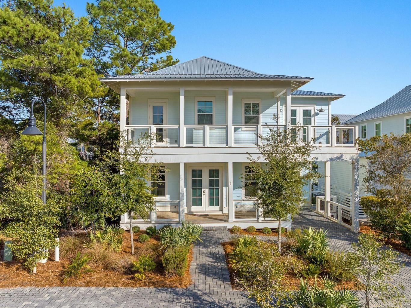 Like-New Coastal Retreat Steps to Old Blue Mountain Beach Access -- Fully Furnished & Investor-Ready. Welcome to 20 Ashley Lane, a beautifully maintained coastal home that shows like new -- because it truly is. This has not been used as a short-term rental, this property has been lovingly cared for as a private residence, and it shows in every detail: pristine finishes, spotless furnishings, and none of the wear and tear typical of a rental-history home along 30A. Buyers get the rare opportunity to purchase a turnkey property with a completely clean slate.  Situated a short walk to the community pool and less than a half mile from easy beach access with parking, this 4 bedroom, 3.5 bath home is the ultimate vacation escape featuring over 1,200SF of covered porches and balconies, an attached garage, and an inviting open floor plan. Interior features include LVP flooring, quartz countertops, and more.

Tucked in the highly desirable Lakeside at Blue Mountain, this home offers unbeatable proximity to a coveted beach access, putting the sugar-white sands and emerald waters of the Gulf just moments from your front door. Whether you're headed out for a sunrise walk on the beach or an evening stroll to catch the sunset, the location is second to none.  Enjoy the afternoon shopping and dining in Blue Mountain Beach, paddleboarding on Big Redfish Lake, or exploring neighboring communities along Scenic 30A via the bike trail. Offered fully furnished, 20 Ashley Lane is ready for its next chapter -- however you envision it. Move in and enjoy it as a full-time residence in one of 30A's most sought-after pockets, use it as your personal beach getaway, or capitalize on its prime location and near-new condition to launch it as a high-performing short-term rental. With strong nightly rental demand in the Old Blue Mountain corridor and a home that's already dialed in and rental-ready, this property is positioned to become an investment powerhouse from day one.