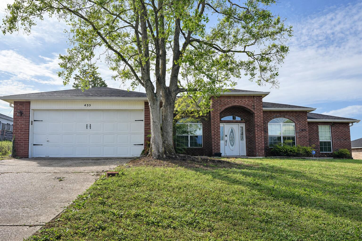 SHORT SALE. Offer has been submitted to lender and is awaiting approval. Accepting backup offers. Located just south of I-10, this home offers an easy commute to the base, shopping, and daily conveniences. Split floor plan with three bedrooms on one side and a private primary suite on the other, plus a flexible dining or office space. Kitchen features granite countertops, farmhouse sink, stainless dishwasher, and an eat-in area with ample cabinet space. Laminate wood flooring runs through the main areas, with newer carpet in the bedrooms. Primary suite includes a walk-in closet, double vanity, soaking tub, and separate shower. Fenced backyard, rain gutters, and storage shed included. Strong value with solid features. Sale subject to lender approval.