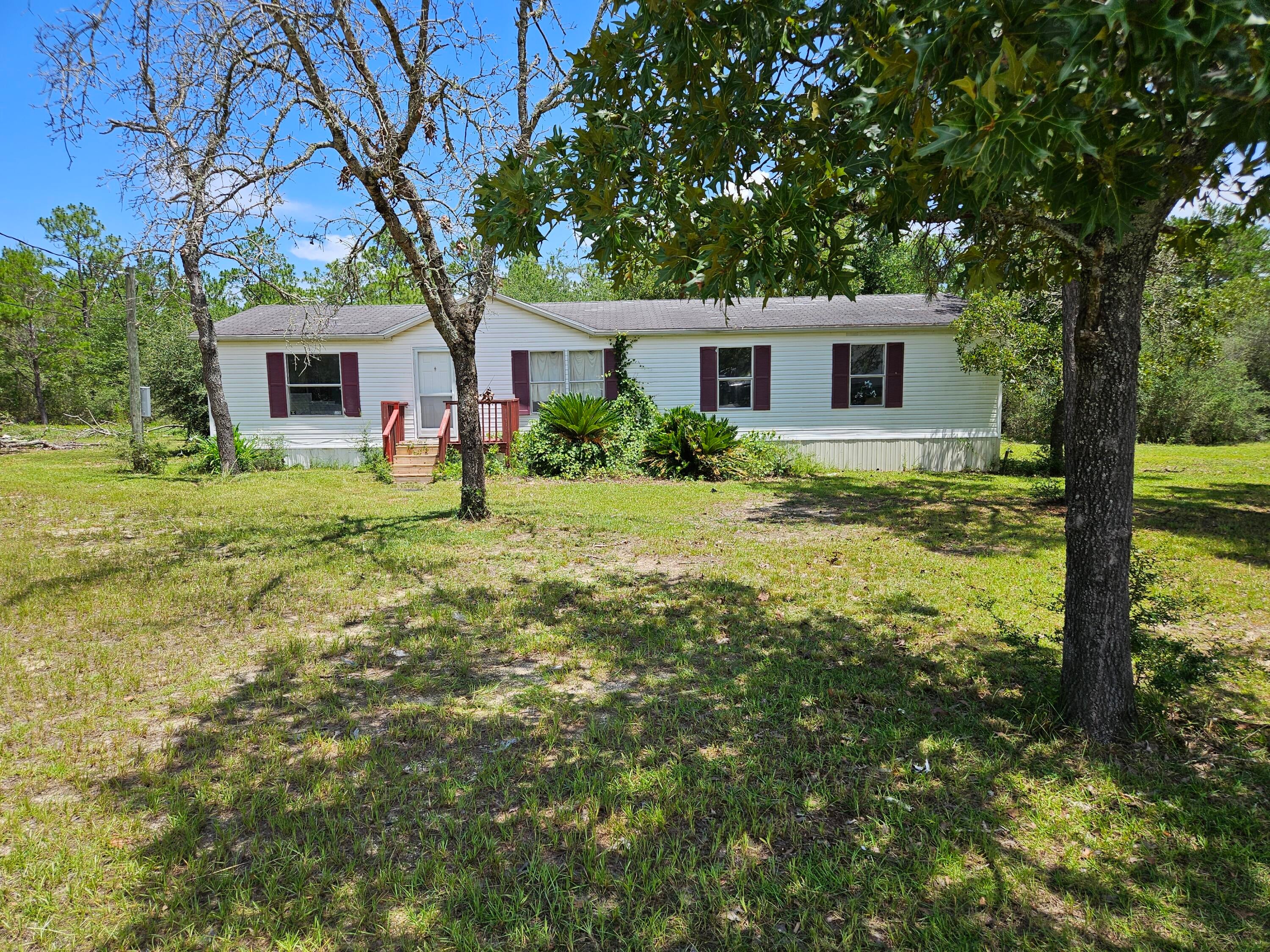 Affordable opportunity in Oakwood Hills! Mobile home situated on a 0.38-acre lot with plenty of potential for renovation and customization. Ideal for investors, flippers, or buyers looking to create their own space. Enjoy the privacy and flexibility of a large lot while being conveniently located near DeFuniak Springs amenities. New Central Air replacement in 2024. Roof is original. Property is being sold as-is.