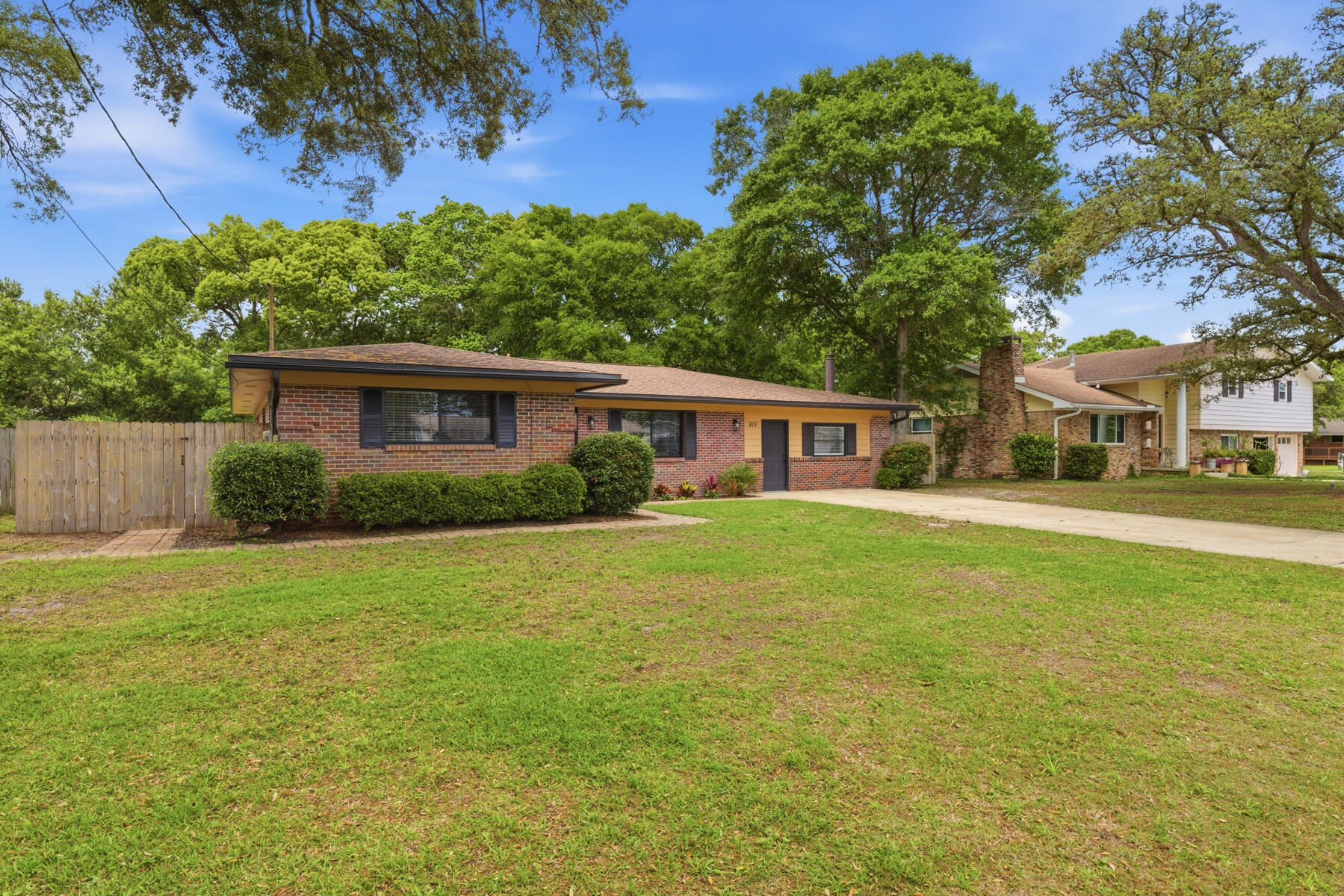 Welcome to 215 Sotir Street, a beautifully updated residence in a prime Fort Walton Beach location. Offering 2,146 sq. ft. , this 3-bedroom 2-bathroom home blends timeless comfort with thoughtful modern upgrades. Freshly painted interiors, new carpeting, updated flooring, new blinds, and all brand-new appliances create a move-in environment. The expansive layout features a gracious living room, a separate family room with a cozy fireplace, and a formal dining area- ideal for both everyday living and elegant entertaining. The kitchen is well-appointed with abundant cabinetry and a stylish tiled backsplash, offering both functionality and charm. Each bedroom is generously sized with two closets and features providing exceptional storage space. Additional storage is found throughout the home including a foyer closet and two hallway closets. The bathrooms are tastefully designed, highlighted by a beautifully remodeled primary bathroom. Outdoors, a spacious backyard, and a covered patio area provide a private setting perfect for relaxing or hosting gatherings.