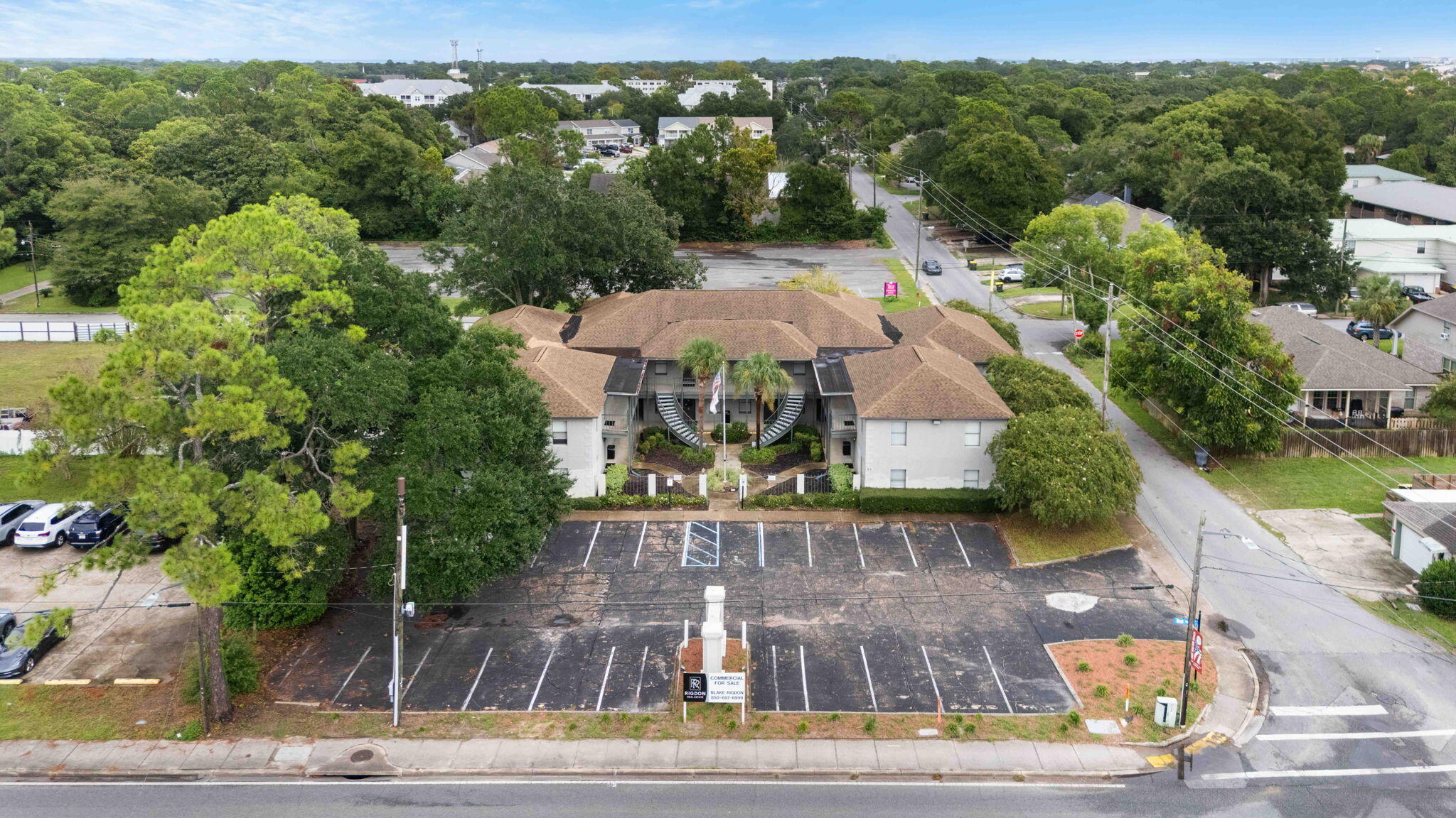 Prime Fort Walton Beach commercial opportunity on one of the city's highest traffic commercial corridors. This offering includes two contiguous parcels: a 14,440 SF office building on 0.66 acres fronting Beal Parkway, plus a 0.99-acre parking lot immediately behind the building on Shell Avenue. The building is configured with 16 units, eight 1,000 SF suites and eight 500 SF suites. Dual-street access is a major advantage: Beal Parkway provides exceptional visibility and front-door exposure, while the Shell Avenue lot delivers substantial parking, overflow capacity, and a second point of ingress and egress. Well suited for professional services, medical or dental users, government contractors, administrative headquarters, or an investor seeking a visible, well-located asset with extra land.  Buyer to verify unit sizes, zoning, parking counts, and all measurements.