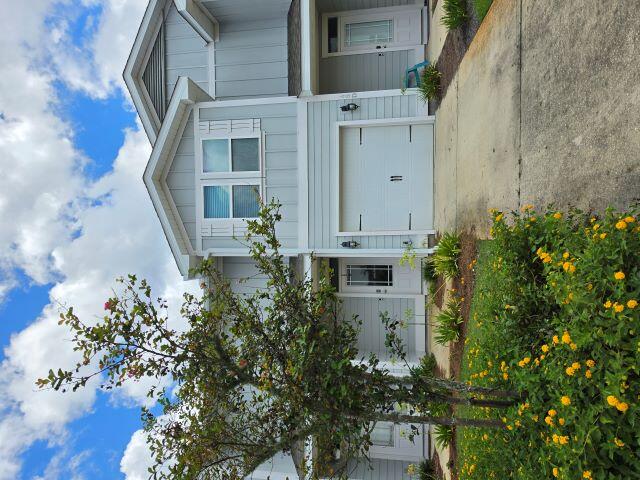 AVAILABLE NOW! FIRST TWO WEEKS FREE!  Welcome to coastal living at its finest! Nestled at 45 Crossing Lane Unit C in beautiful Santa Rosa Beach, this stunning 3-bedroom, 2.5-bath townhouse offers the perfect blend of modern comfort and beachside charm. Designed for beach lovers, this residence boasts a bright open floor plan with EVP flooring and plush carpeting in the bedrooms.  The spacious kitchen is a chef's dream, featuring gleaming granite countertops, stainless steel appliances, a convenient breakfast bar, and ample cabinetry. The airy living area flows seamlessly onto a private patio, where you can unwind and take in tranquil lake views, ideal for morning coffee or evening sunsets. Upstairs, the generous master suite features a large tiled shower and an abundance of closet space. The included washer and dryer make laundry days a breeze. Added conveniences include a security system with app-enabled controls for lights, garage, and door locks (subscription paid by tenant and optional), plus lawncare included in rent for truly maintenance-free living. Enjoy beautiful landscaping, a single-car garage, and unbeatable access to the area's top attractions--just minutes from the world's most beautiful beaches, vibrant shopping, and dining options. South Walton High is within walking distance, and pet owners will love being just a couple miles from Alaqua Unleashed Bark Park. Don't miss your chance to make this coastal-style townhouse yours where every day feels like a vacation. Schedule your tour today!  Tenants to verify items of importance such as room measurements and school zones.  No smoking or vaping.  No cats, one small dog 30 lbs or less with owner approval and nonrefundable pet fee. Credit and criminal check required.