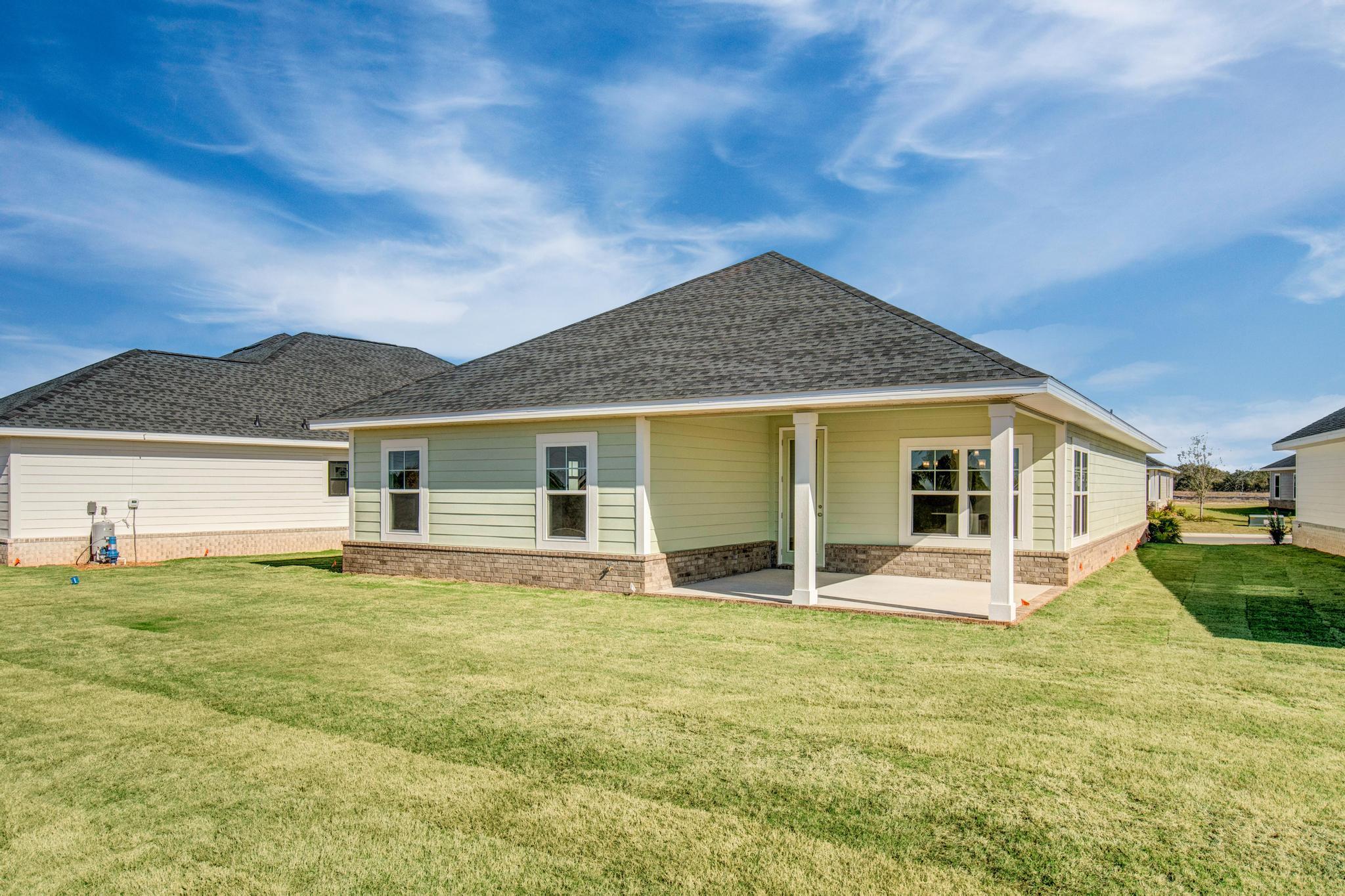 This popular Craftsman-style 3BR/2BA home (currently under construction: (Est. August / Sept. N ext to the entrance of the community (across from model). Designed with both comfort and style in mind, the home features HardieBoardÂ® siding with a brick skirt, vaulted ceilings,  and CoreTec Pro Plus luxury vinyl plank flooring throughout--no carpet. The spacious primary suite boasts elegant tray ceilings, a generous walk-in closet, and a spa-inspired bath. Quartz countertops in the kitchen and baths, soft-close cabinetry, spacious covered patio complete this inviting home, perfect for relaxed everyday living and entertaining. Bluffs residents enjoy a community pool, and bathhouse, near the Florida Trail offering plenty of opportunities to get outside and enjoy the Florida life style.  *Pics are of a similar home.*