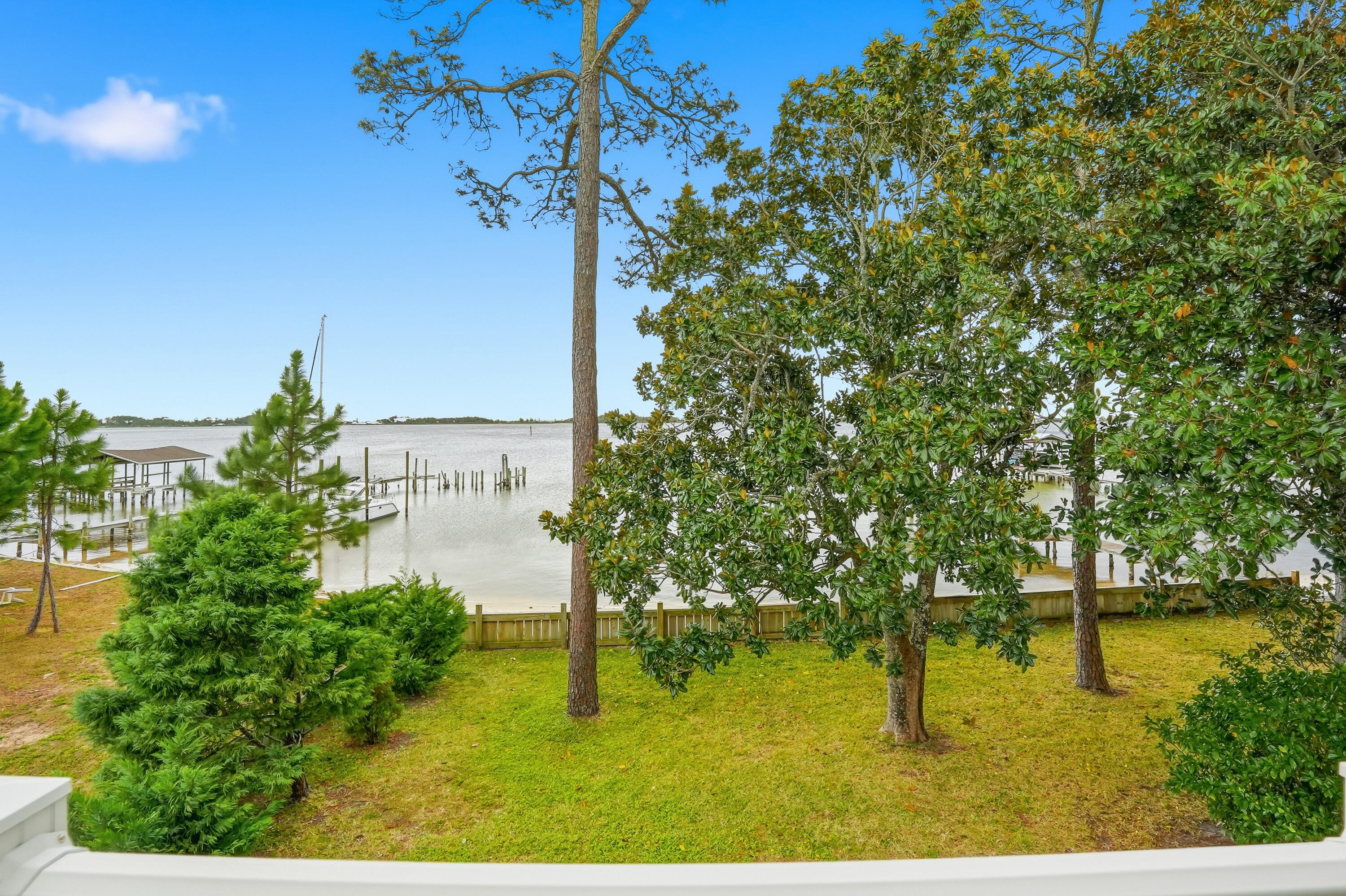 **Waterfront living meets investment opportunity on the Santa Rosa Sound!** With **115 feet of waterfront**, a private dock with spacious sundeck, & a **separate 1,200 sqft. apartment above the garage**, this one-of-a-kind property offers the flexibility to enjoy the waterfront lifestyle while creating income potential. Whether you're searching for a primary residence, vacation home, multigenerational property, or a home with space for guests, this property delivers options that are hard to find.
The main home offers beautiful water views, a bay-window breakfast nook overlooking the Sound, tile flooring throughout, & extensive updates including a full renovation in 2005-2006, plus a new roof, HVAC, & updated plumbing in 2021, & new water heater 2026. The private apartment features its own entrance, balcony, washer and dryer, HVAC, water heater, & security system, making it ideal for extended family, guests, or rental opportunities.
A 400 sq. ft. office with a separate entrance provides additional flexibility for a home business, studio, or potential guest suite. Additional features include a concrete safe room, workshop, hurricane shutters, circular driveway, & storage throughout. From boating, fishing, & paddleboarding off your private dock to enjoying spectacular sunrises & sunsets over the Santa Rosa Sound, this is more than a waterfront home--it's a rare opportunity to own a property that offers lifestyle, flexibility, & long-term value. 1.4 miles to Hurlburt Field.