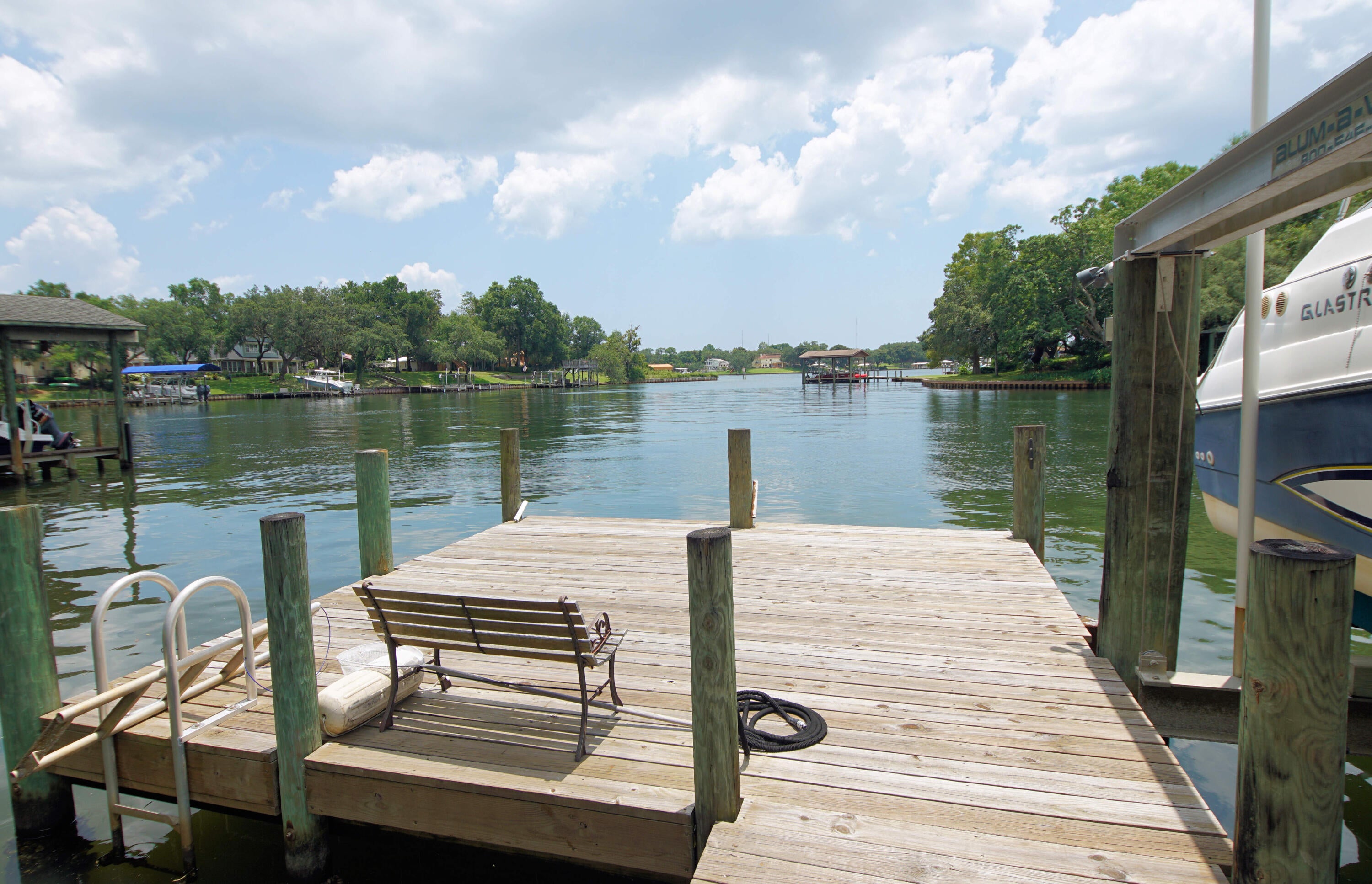 EXQUISITE Custom Tudor-Style Protected Waterfront Home with Stunning Views. X Flood Zone!! Kitchen Just Updated to Include Quartz Countertops, New lighting, Flooring, and Appliances. Roof 2023, Kohler Generator 2023. Welcome to your Dream Home nestled on a private, tree-lined drive in a tranquil, protected bayou. This exquisite 3-bedroom 3.5 bathroom residence offers a perfect blend of Elegance, Comfort, and Breathtaking Natural Beauty. Step inside to discover spacious living areas bathed in natural light from large windows that provide stunning views of the water. Expansive living room is perfect for both relaxing and entertaining. The master suite serves as a private retreat, complete with an en-suite bathroom and a generous walk-in closet. Each additional bedroom is equally inviting, with natural light and serene views, and the bathrooms are thoughtfully designed. And a POOL! This Home also has Fiber Optic Internet for Quick Connections. (Buyer to confirm all measurements)