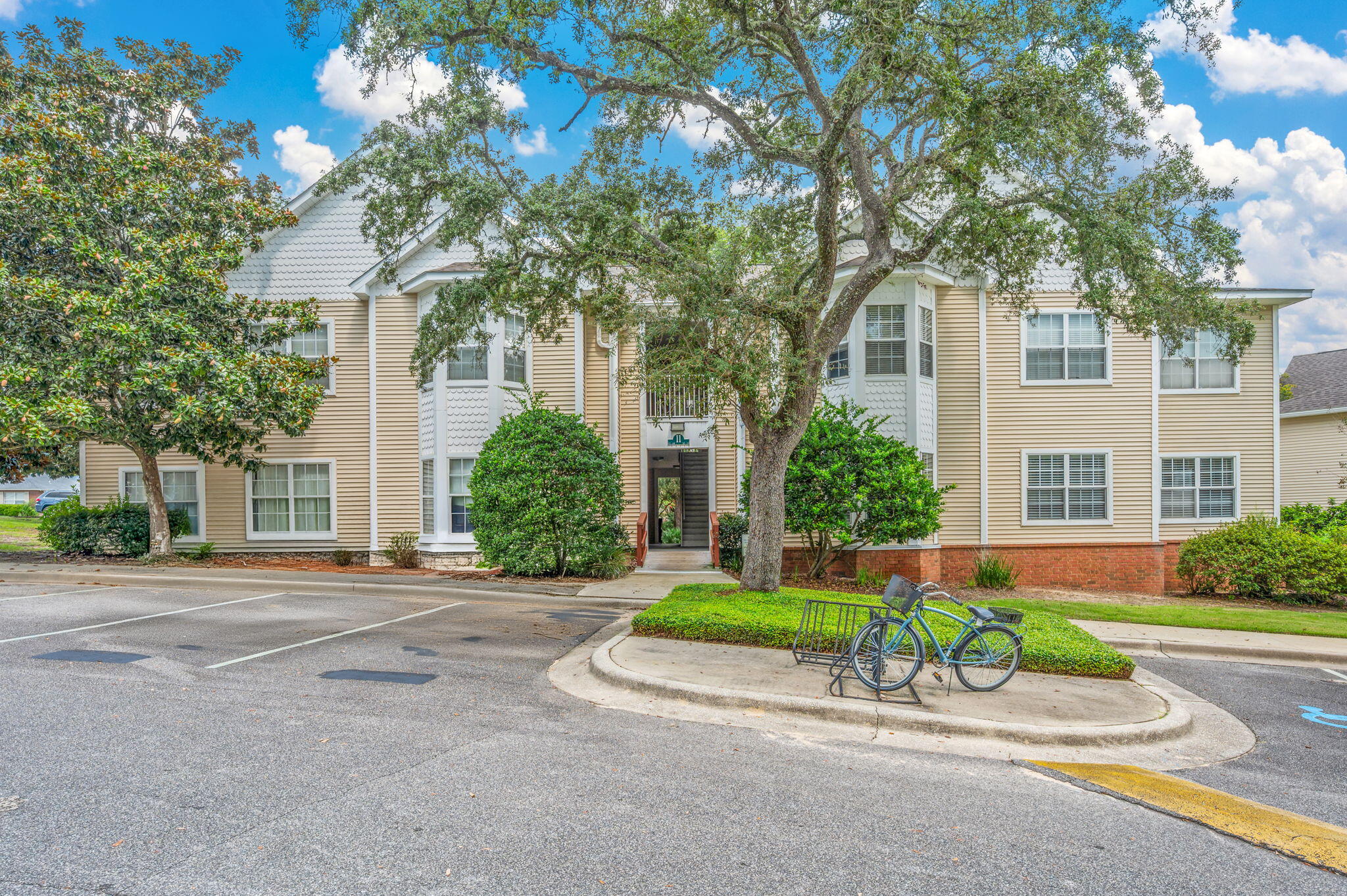 Welcome to this charming two-bedroom, two-bath condo located in the desirable Oaks community. Featuring an open and functional layout, this home offers a perfect blend of style and comfort. The interior boasts attractive wood-look laminate flooring, a bright bay window, and fresh paint throughout. The dedicated dining area flows into the kitchen, complete with stainless steel appliances, crisp white cabinetry, and ample natural light. A stylish tile entry and ceiling fans add both convenience and charm. The primary suite includes a walk-in closet and an en-suite bath with a bathtub/shower combo. The spacious guest bedroom has easy access to the second full bath, which features a large vanity and a walk-in shower. A stackable washer and dryer are included for your convenience. Outside, enjoy plenty of parking and access to community amenities, including a sparkling pool--perfect for relaxing and socializing. Contact us today for a showing!