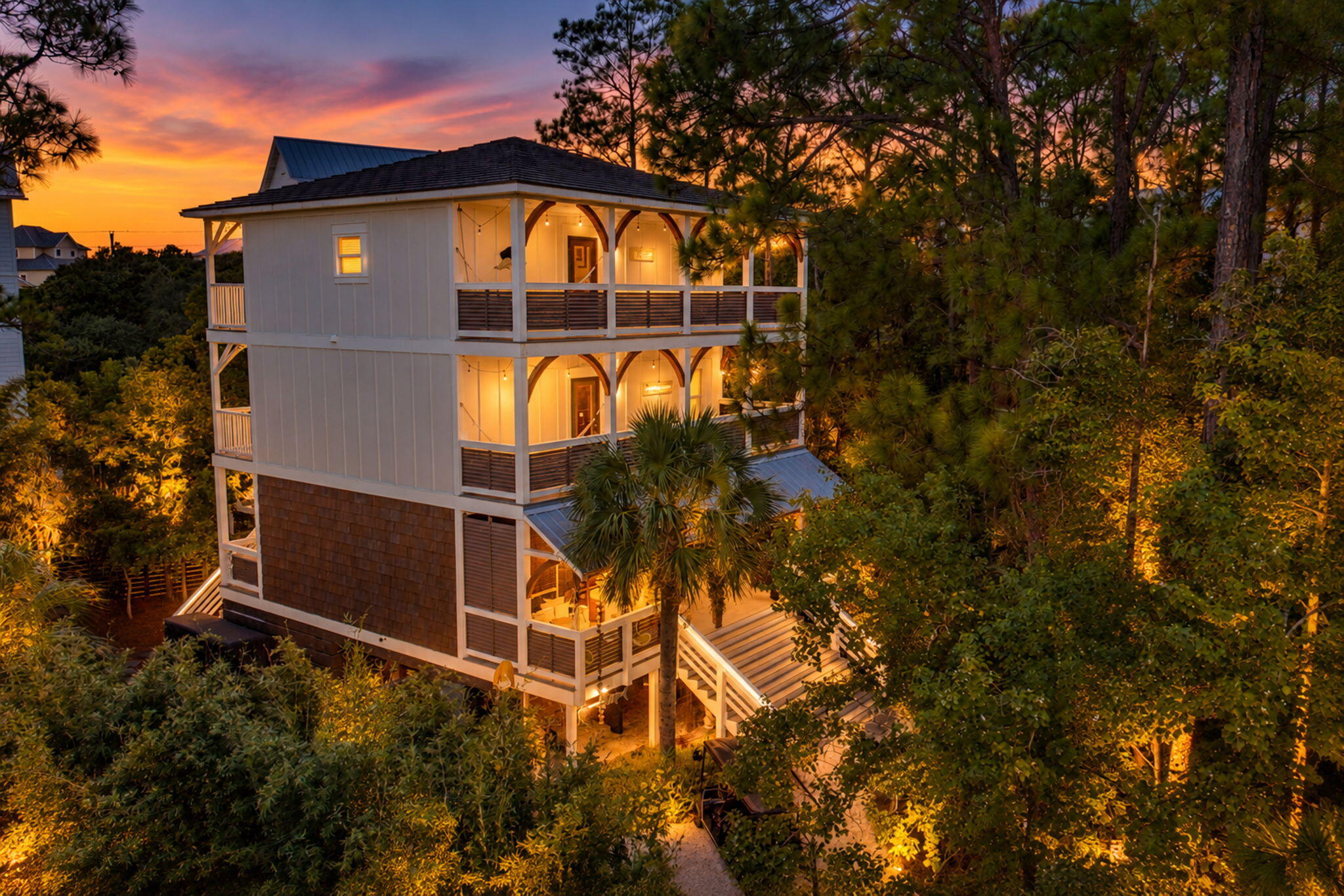Just minutes from the beach, 157 Baird Road offers an unexpected sense of tranquility in the coveted Beach Highlands neighborhood on 30-A. Cascading stone waterfalls, a pond, mature landscaping, Gulf views, and multiple outdoor living spaces give this 3-bedroom, 3.5-bath home a character all its own. With approximately 2,650 square feet and no HOA, the property offers space and flexibility for enjoying the 30A lifestyle.
The water and landscape are at the heart of the experience. Approximately 11,000 pounds of fieldstone and aged flagstone were brought in from Alabama to create the custom waterfalls. Submerged pumps circulate water over the stone, creating the calming sound of moving water throughout the outdoor areas. 
Inside, the three-story layout blends coastal character with comfortable gathering spaces. Shiplap, raised ceilings, built-ins, recessed lighting, and a fireplace add warmth and texture. The kitchen features a large island and breakfast bar, pantry, and wine refrigerator and connects naturally with the living and dining areas.
The three bedrooms and 3.5 baths are arranged across multiple levels, with the primary suite on the third floor. Balconies and covered porches provide different perspectives of the surrounding landscape, water features, and Gulf views. An outdoor shower and generous parking add practical convenience for time spent at the beach. An approximately 400-square-foot game room adds valuable living and entertainment space and is currently set up with a sectional sofa, arcade game, foosball table, and wall-mounted TV. It creates a separate place for games, movies, and downtime without taking away from the home's primary living areas.

Located on the west end of 30A, the home is convenient to the beaches of South Walton, dining, shopping, biking, and recreation. For buyers considering the property as a vacation rental, projected annual gross rental revenue is approximately $90,000 to $130,000. What ultimately distinguishes 157 Baird Road is the opportunity to retreat into a peaceful natural setting while remaining close to everything that makes the 30A lifestyle so desirable. Buyer to verify all dimensions.