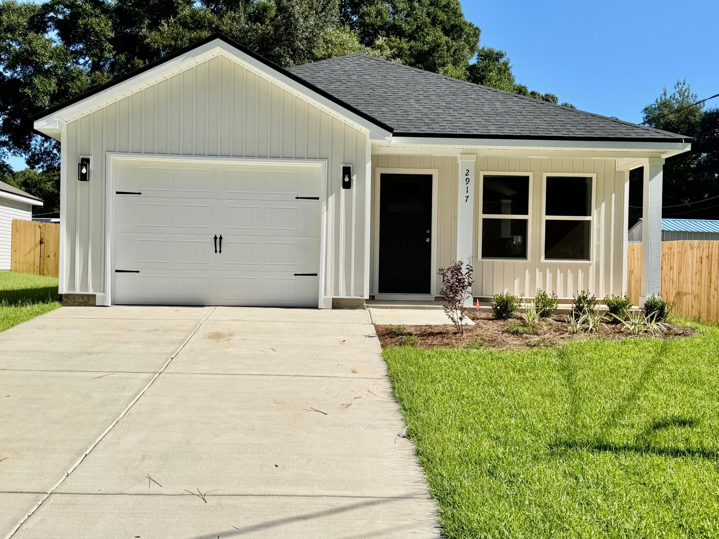 This inviting rental offers the perfect blend of modern finishes, comfortable living spaces, and a convenient location. Enjoy low-maintenance vinyl plank flooring throughout, a beautifully landscaped yard with privacy fencing, and both front and rear porches for relaxing outdoors. The finished garage adds extra convenience and storage space. The open interior features raised ceilings, recessed lighting, and ceiling fans throughout. The kitchen is designed for both everyday living and entertaining, with white shaker-style cabinets, quartz countertops, a large work island with bar seating, and a corner walk-in pantry. The spacious owner's suite offers a walk-in closet and private bath with double vanities. A large laundry room makes everyday chores a little easier. Located close to shopping, dining, schools, and other amenities, this home is ready to provide comfortable and convenient living in the heart of mid-town! Application available upon request.