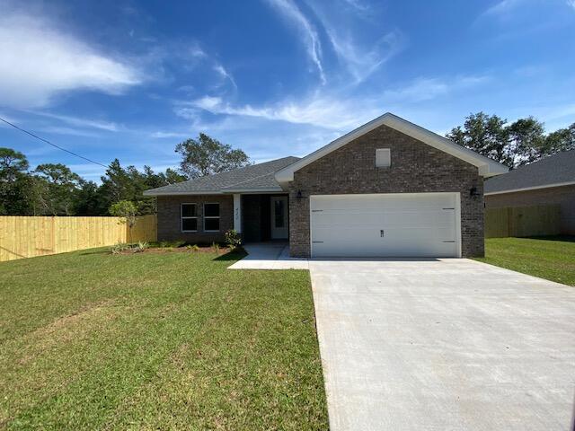 Step into effortless living with this stunning all-brick home ideally located just minutes from local bases, beautiful beaches, and everyday shopping. Designed with both style and functionality in mind, this home showcases high-end finishes and thoughtful upgrades throughout.

Inside, you'll find an upgraded entryway with a shoe bench and coat rack. Wood-look tile flooring flowing seamlessly through the main living areas - including the foyer, kitchen, bathrooms, and laundry room, offering both durability and modern appeal. The living room is elevated by a stylish alcove ceiling, creating added height and an open, inviting atmosphere.

The tucked-away kitchen is a true standout! Bright, modern and perfect for entertaining. It features quartz countertops, crisp white cabinetry, soft-close drawers, and a spacious breakfast bar accented with decorative pendant lighting, making it ideal for casual dining or hosting guests.

The primary suite offers a relaxing retreat with a generously sized bedroom and a beautifully appointed en-suite bathroom. Indulge in the comfort of dual walk-in closets, a tiled walk-in shower, and a separate soaking tub, perfect for relaxing after a long day.

Enjoy added convenience with a dedicated laundry room featuring a folding table for extra workspace, plus direct access to a spacious two-car garage.

Step outside to a covered back porch, ideal for relaxing or entertaining overlooking a fully fenced backyard that wraps around the home and features a convenient access gate. This property offers everything you need. Don't miss your opportunity to make it yours. Contact us today for a showing!