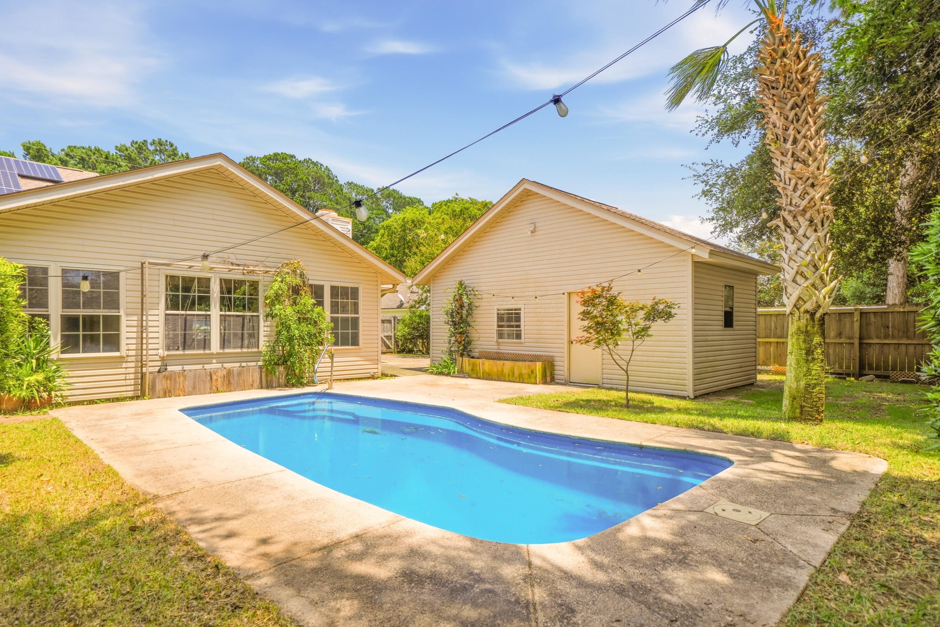 Rare rental opportunity featuring a private pool, three garage spaces, an oversized heated and cooled workshop and solar panels that help keep electric costs remarkably low. Designed for those who appreciate space, versatility, and exceptional amenities, this one-of-a-kind property offers the perfect blend of comfort, functionality, and outdoor living.

Inside, you'll find a spacious great room with a cozy fireplace, a formal dining room, and an eat-in kitchen perfect for everyday living. Three generously sized bedrooms provide plenty of space, while the heated and cooled sunroom offers endless possibilities as a home office, fitness room, playroom, or additional living area.

The private upstairs primary suite features a walk-in closet and convenient access to attic storage.

Step outside and unwind in your own backyard oasis complete with an in-ground pool--perfect for entertaining, relaxing, or soaking up Florida's beautiful weather year-round.

Need room for projects, hobbies, or recreational toys? This property delivers with an attached two-car garage, a detached one-car garage, and an impressive 25 x 40 heated and cooled workshop featuring a 30-amp 220/240 outlet--ideal for woodworking, mechanics, hobbyists, or additional storage.

The circular driveway provides abundant parking for multiple vehicles, boats, RVs, or guests, while the home's solar panel system helps keep monthly electric costs exceptionally low.

Recent improvements, including a newer roof, HVAC system and fencing, provide added comfort and peace of mind.

Conveniently located in Niceville near top-rated schools, shopping, dining, military bases, and the area's beautiful waterways, this exceptional rental offers a rare combination of space, flexibility, and amenities that are difficult to find.

Schedule your private showing today and discover everything this incredible property has to offer.