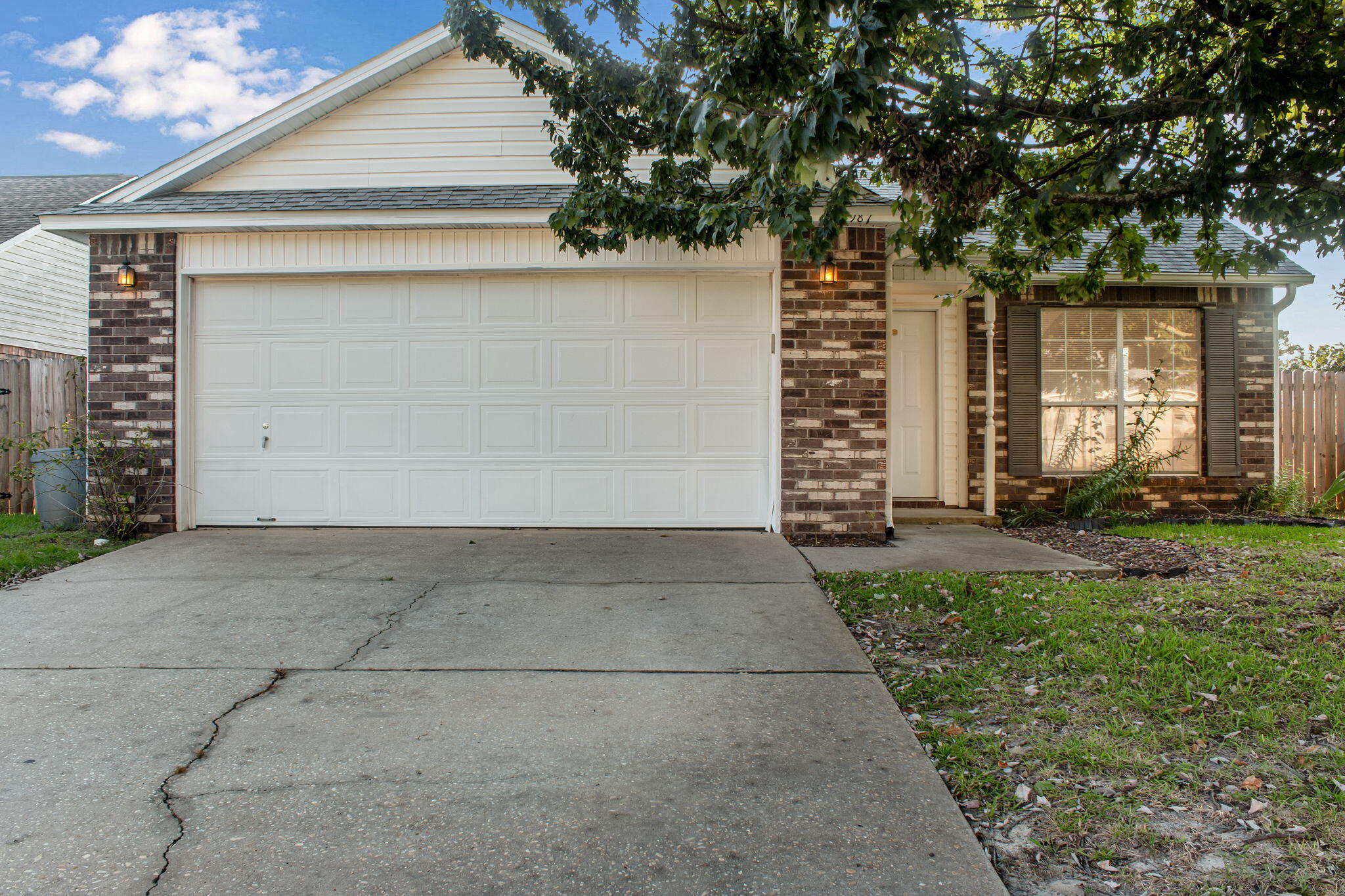 his 3BR/2BA corner lot rental home is one of the best values in Fort Walton Beach and is awaiting your personal touch! The living room is open and inviting. The kitchen is adjacent to a cozy breakfast nook that overlooks the well-kept back yard through sliding glass doors. It also makes it super easy to keep an eye on the kids or fur babies while they play. Hard floors in the kitchen and bathrooms give you peace of mind in those areas where spills are most likely to happen. The laundry room is also already equipped with a washer and dryer for your convenience. The master bath boasts a double vanity and a garden tub, and the bedrooms are conveniently tucked away on one side of the house away from the living area.

Enjoy outdoor living with an open patio and fenced in back yard for privacy. This outdoor space is awaiting your summer barbeques. Stroll around the side of the house and you even have your own lime tree. Lawn care is included so this yard space comes with hassle free enjoyment.
This home is just a short drive from our military bases and is also centrally located near schools, medical facilities, shopping and restaurants. Schedule a showing today!

Basic lawn care included. Tenant pays all utilities. Holding fee is due within 24hrs of approval. Lease must start within 14 days of payment. Lease Prep Fee of $75 is due prior to move in. Approved pets require $400 pet fee per pet. Renters insurance is required.