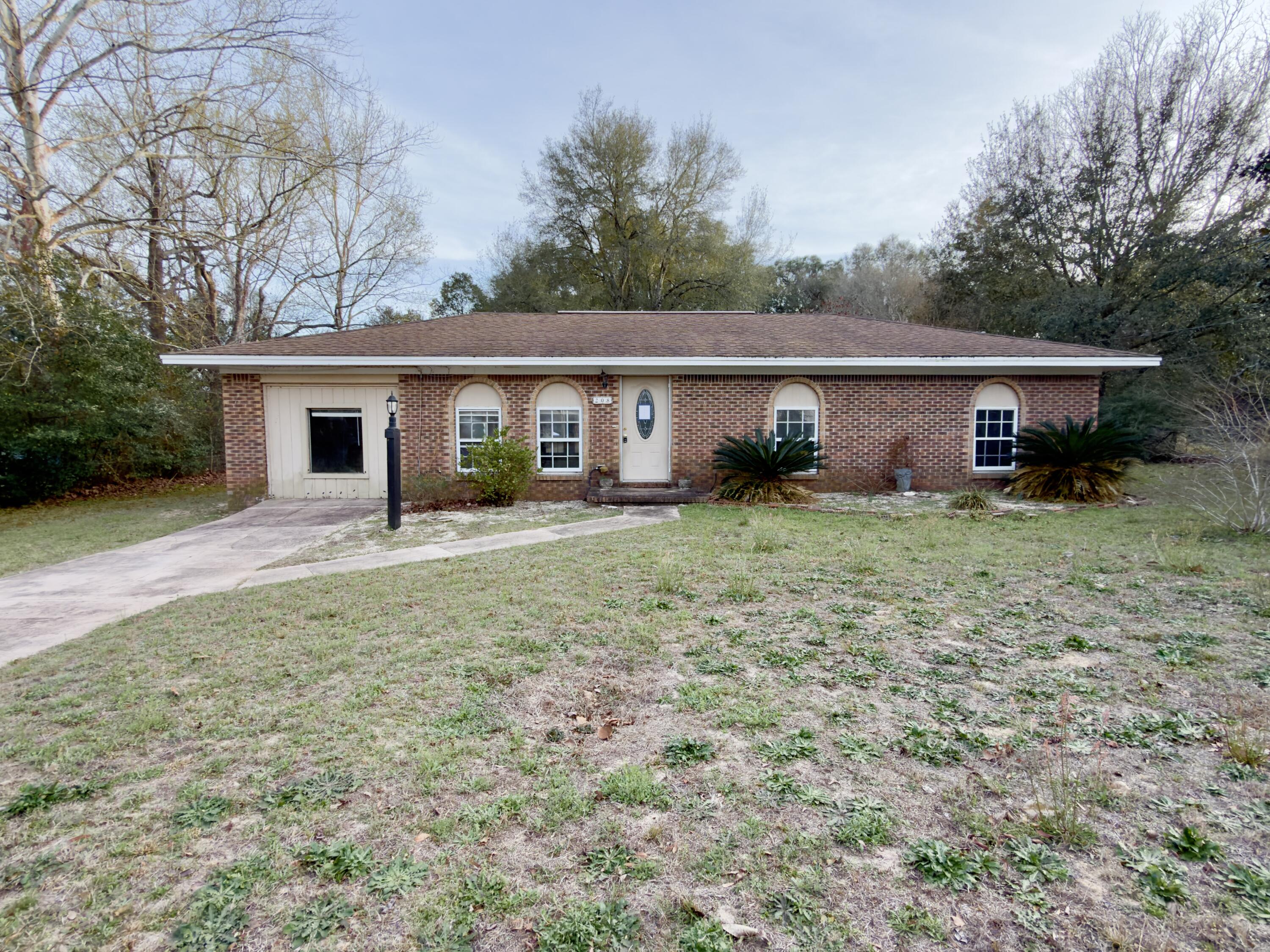 Your next REO opportunity awaits! This all brick  was built in 1975 home and is located between Hwy 90 and Airport Rd. Just a few miles from schools, grocery, churches and more, this 3-bedroom, 1-bathroom home has an open Kitchen-Living room layout, bonus room and an indoor laundry room. The entire property has chain-link fence, and comes with a huge detached workshop. Whether you're looking for a rental addition, a fix-and-flip, or starter home this property is one to add to the list.