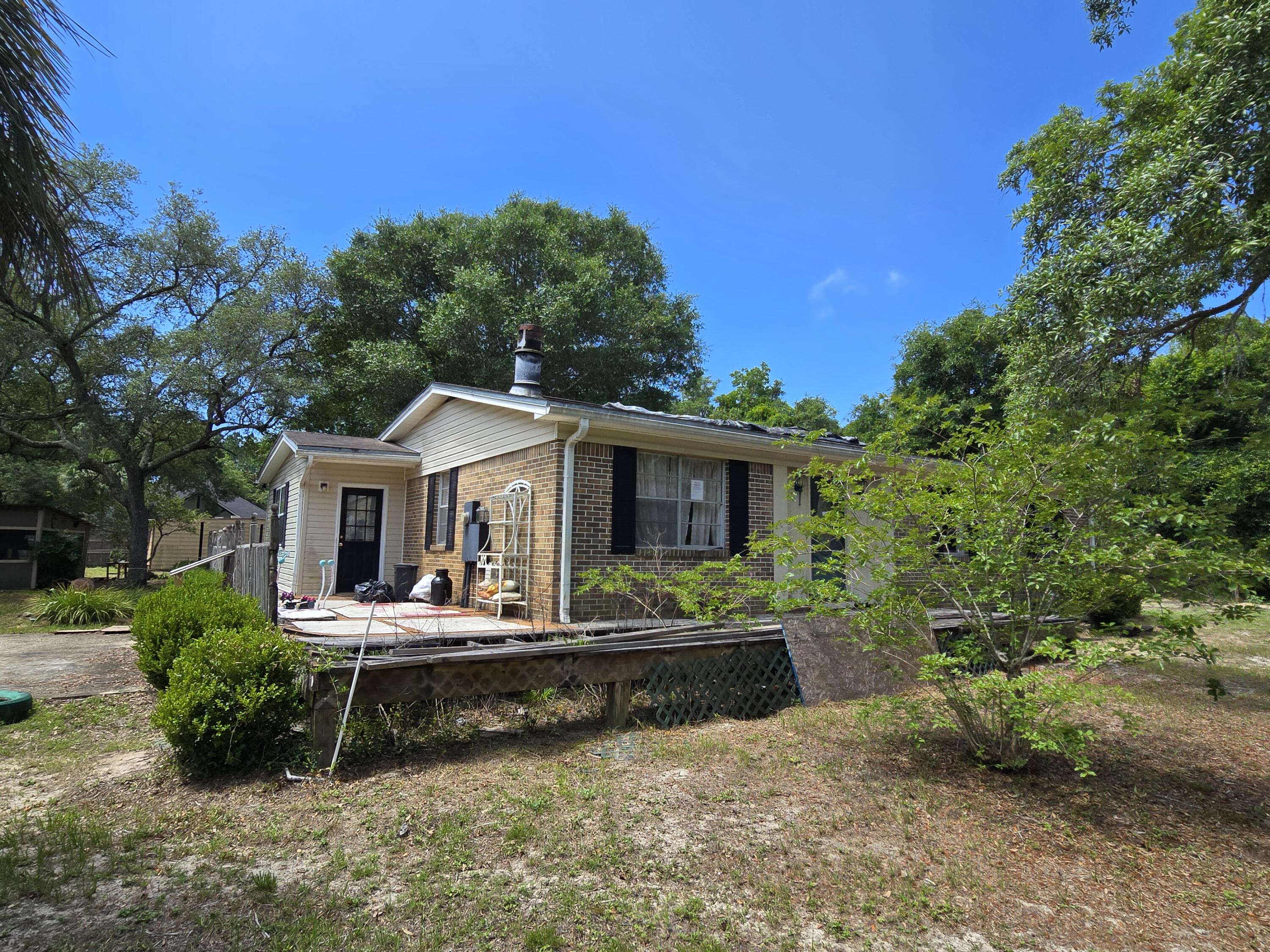 The value is in the land! Nearly 3/4 of an acre on East Bay Blvd. Home is in need of repair. The possibilities are endless!