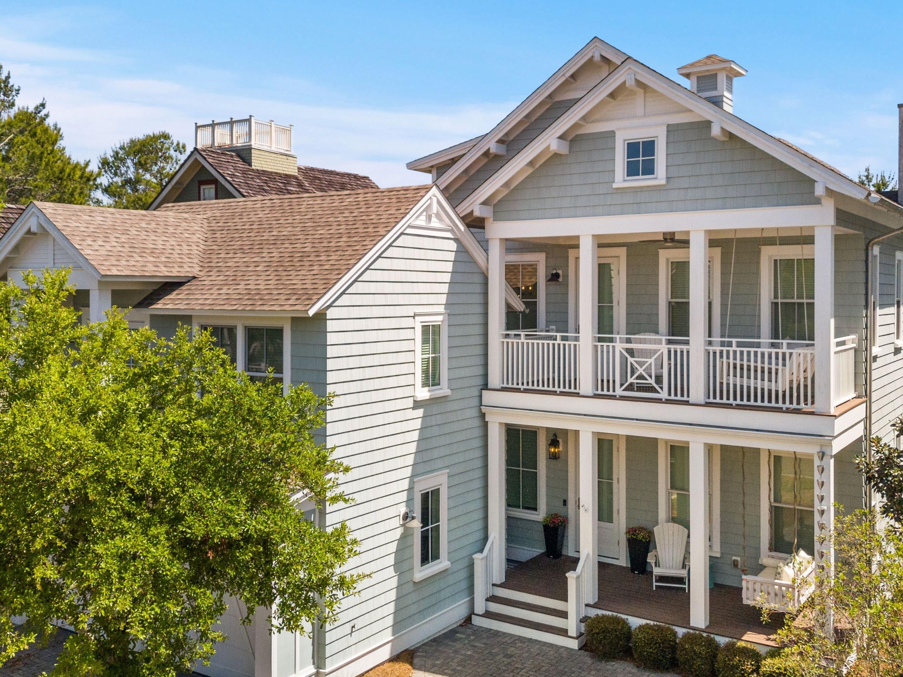 Live every day like you're on vacation in this stunning five-bedroom, seven-bath beach cottage with a private carriage house and two-car garage, nestled in sought-after WaterSound Bridges. Thoughtfully designed with timeless coastal charm and high-end finishes, this residence offers spacious indoor and outdoor living areas, perfect for relaxation and entertaining. The gourmet kitchen is a chef's dream, featuring Thermador appliances, gleaming Carrara marble countertops, custom cabinetry, a built-in wine fridge, and an ice maker. A hidden walk-in pantry offers additional storage, while the oversized marble-topped island provides ample space for meal prep and casual dining. The open-concept design flows seamlessly into the inviting living room, where exposed wood beams, a stone fireplace with a reclaimed wood mantel, and built-in shelving create a warm yet sophisticated atmosphere.

Designed for seamless indoor-outdoor living, this home features multiple porches at the front and back, ideal for enjoying morning coffee or evening sunsets. A screened porch with an outdoor kitchen, built-in grill, and cozy sitting area extends the entertaining space, while the private splash pool with a tranquil waterfall feature offers the ultimate place to unwind. After a day on the beach, rinse off in the convenient outdoor shower before retreating inside.

The primary suite is a luxurious haven, complete with vaulted ceilings, a private balcony, and a spa-like en suite bath. The master bathroom features Carrara marble floors, a freestanding soaking tub, dual vanities, and a glass-enclosed walk-in shower with intricate tilework. Each of the five bedrooms is beautifully appointed, with ensuite baths, ample natural light, and refined coastal design elements.

The private carriage house offers independent guest accommodations, featuring a full kitchen, living area, bedroom, and private balcony, making it perfect for visiting guests, extended family, or rental opportunities. This home is equipped with a whole-home Generac generator, ensuring reliability year-round. Located just minutes from the pristine white-sand beaches of 30A, where days can be spent surfing, sunbathing, or enjoying twilight bonfires, this home captures the essence of luxury coastal living.

Whether you're seeking a primary residence, vacation home, or investment property, this WaterSound Bridges retreat is an extraordinary opportunity to own a piece of 30A paradise.