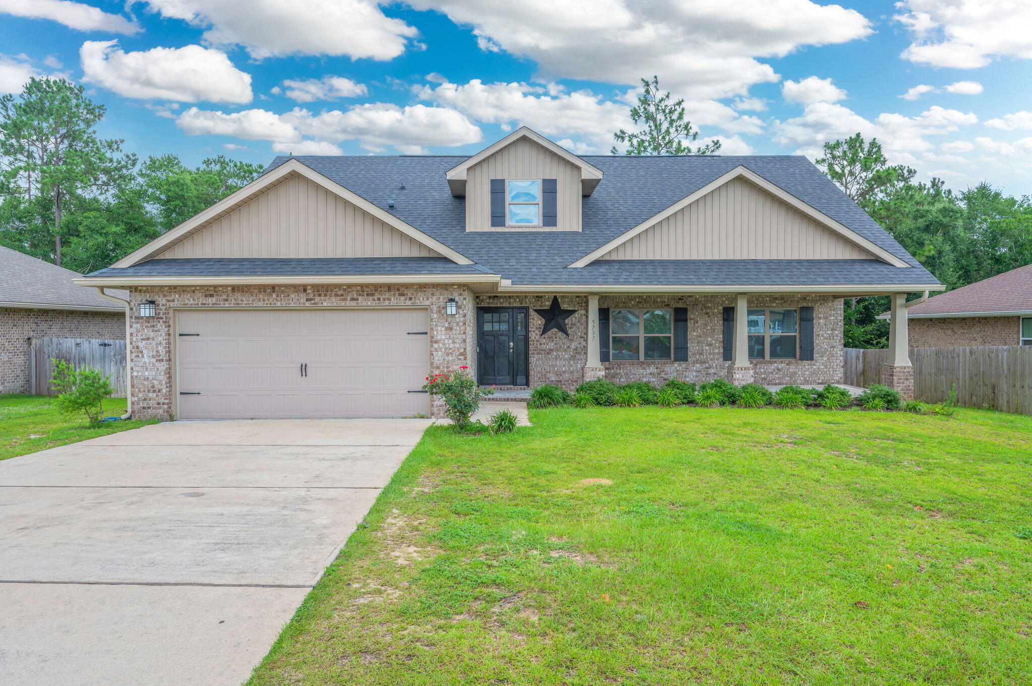 Spacious and inviting, this 5BR/3BA Craftsman-style home offers room for everyone! Relax on the large covered front porch before stepping inside to an open, airy layout designed with comfort in mind. LVP flooring flows throughout the main living areas and wet areas for easy maintenance and durability. The kitchen features granite countertops, ample prep space, and plenty of storage, making it ideal for everyday living and entertaining. The generous primary suite offers a private retreat with an ensuite bath featuring a separate shower, soaking tub, dbl vanities, and abundant space to unwind. Two additional baths provide convenience for family and guests. Upstairs, you'll find an oversized 5th BR, a full bath, and a spacious bonus room--perfect for a media room, playroom, home office, workout area, or multi-generational living. With its flexible floor plan, expansive rooms, and thoughtful design, this home truly emphasizes spacious living inside and out. Irrigation system conveys as-is. Don't miss the opportunity to enjoy the comfort, versatility, and generous square footage this beautiful home has to offer!