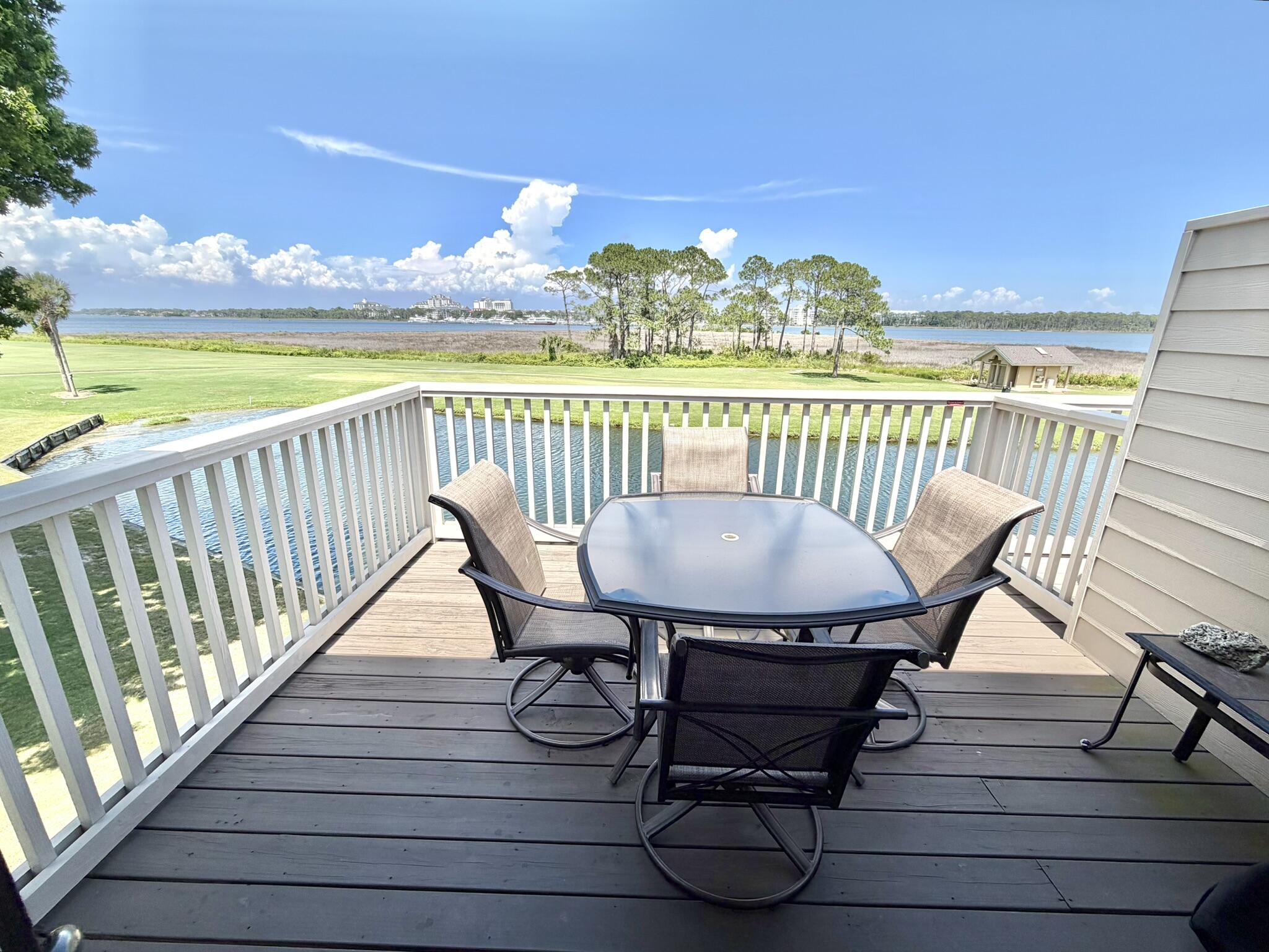 This inviting top-floor end unit welcomes you in with breathtaking panoramic views of the Link's 14th fairway at Sandestin Golf & Beach Resort, stretching across to the Marina, Horseshoe Bayou, and out to Choctawhatchee Bay. It's the ideal spot to unwind after a fantastic day soaking in all that Sandestin offers. Perfect for a golf cart-friendly escape, this well-cared-for unit is ready to be the backdrop for your dream getaway. Warm wood floors flow through the main living area, kitchen & master bedroom, setting a cozy tone. The master bedroom boasts its own private deck and even features pull-down attic stairs, perfect for stowing away items you don't want to haul back and forth with each beach trip. It's time to come see it today and you will know why this is the place for you to stay!