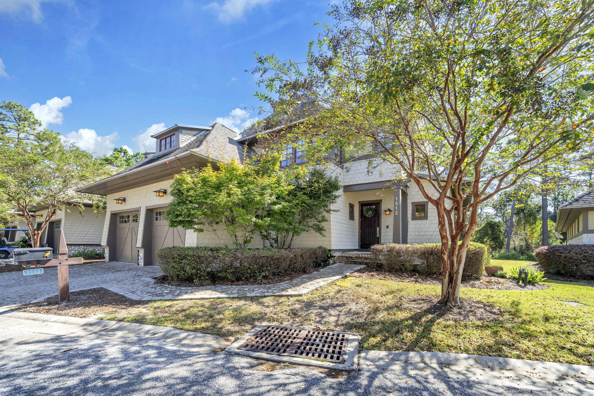 After entering the gate into Wild Heron, you realize you are in a ''Coastal Sanctuary''. Minutes from the beaches and 30A, you immediately feel at one with nature, away from the crowds. This guarded and gated community offers calm and security for both full time residents and second homeowners in this carefully planned low density development of 734 acres. This beautiful townhome is part of an 8 unit condo association that offers luxury living with low maintenance and lives like a single family home. It even has a two car garage! The association takes care of all exterior maintenance, landscaping, master insurance, and pest control. The units are handsome Coastal Craftsman designs by renowned Dungan Nequette Architects. Upon entering the through the foyer, you look into the light filled