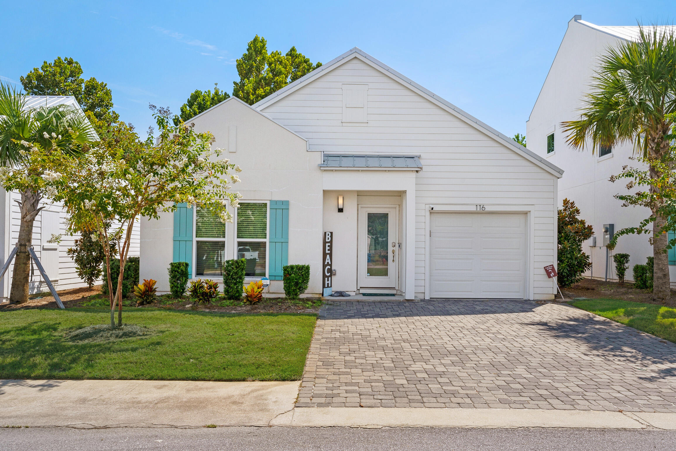 Welcome to Shorewalk in beautiful Panama City Beach, Fl.  This beautiful West Indies style home is just a short stroll or golf cart ride to the beach.  This unique gated community has only 21 homes with a beautiful pool and recreational area.  The single story beach cottage include Hurricane impact windows and doors, 2X6 exterior walls, hurricane tie down rod and anchor system.  Yard work is included with the HOA fees.  Short term rentals are allowed or many have made it their homestead.  .3 miles to beach access.  1.3 miles to Pier Park and all of the restaurants and venues.  Sold furnished and rental ready.  The open living concept floor plan features 3 bedrooms, 2 full bathrooms and a golf cart garage.  The coastal inspired interior design also includes many notable features including 9 ft ceilings throughout with 11 ft vaulted ceilings in the living area, luxury vinyl plank flooring, quartz counter tops.  Samsung stainless steel appliances, high-end cabinetry with soft close drawers  and cabinet doors, lots of cabinet space and under cabinet lighting. Nest thermostat and brick paved driveway and back patio which has been fenced and  paved.