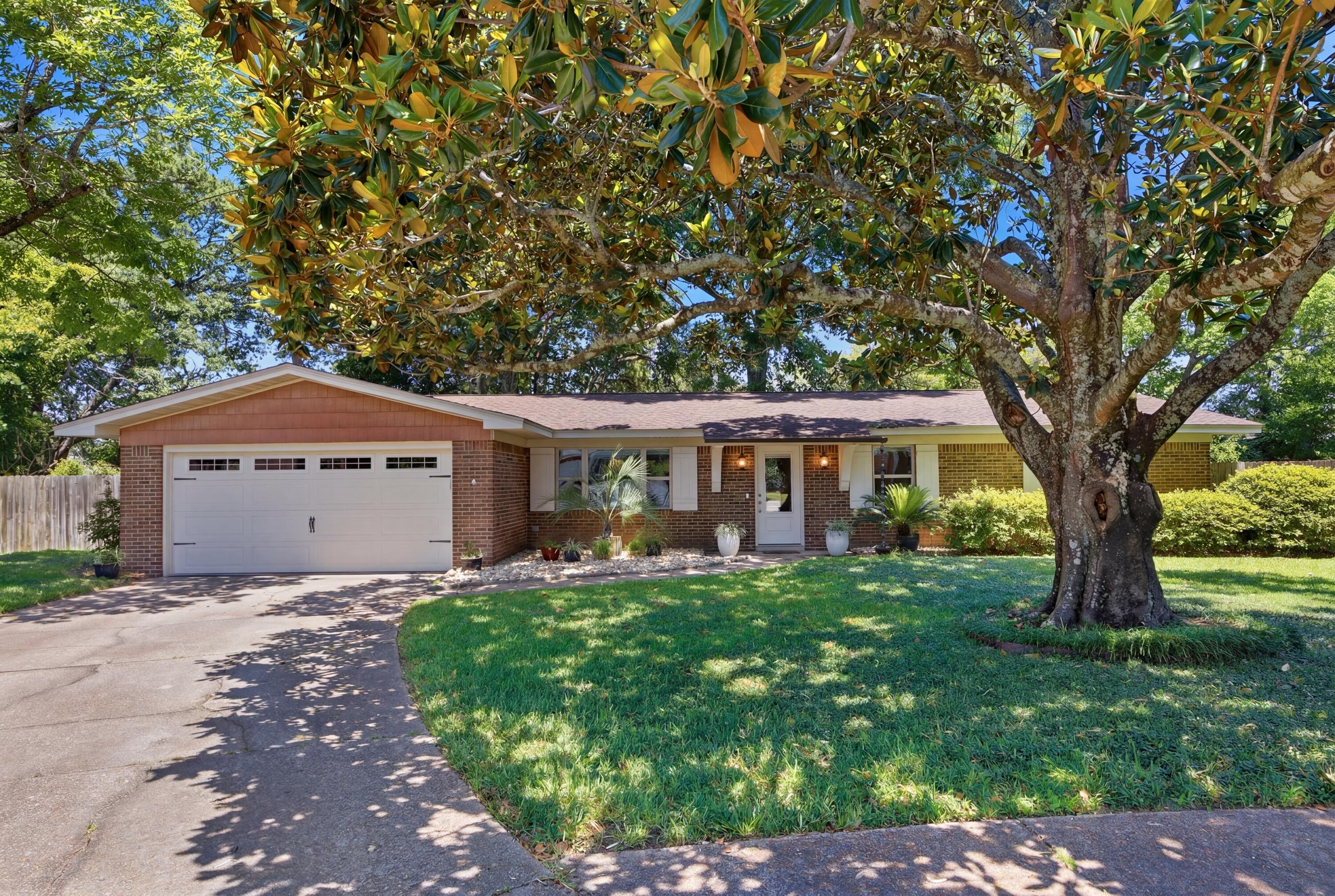 ACCEPTING BACK UP OFFERS. Don't miss this solid four sides brick mid-century home, Ample parking, garage and cul-de-sac location on a large lot are premium features. 

The craftsman entry bracket detail, shutters, and meticulous lawn elevate the curb appeal of this ranch style home. Inside, pride of ownership is obvious and the interior shows beautifully. The separate dining area off of the entry foyer is sunlit by the picture window. Enter into the large kitchen with cabinets galore, a pantry and breakfast bar. Open to the main living area, this is easily the heart of the home. Many gatherings and shared meals surely were had in this space, with more to come as this home's story continues. 

The mudroom and laundry area with exterior door are located off of the living area. The insulated space was added by the current owner and not only increases the square footage of the property, but also functionality. The two-car garage had flooring installed to match the flooring in the addition, and there is fixed shelving for storage and to hold the holiday decor this subdivision is famous for.

Back inside the main living area and through the kitchen is a flex space which makes a perfect office or den. Neutral paint, crown molding, recessed lighting, and easy maintenance flooring in the main living areas creates a classic aesthetic. 

The hallway leads to the secondary bedrooms and bathroom with tub/shower combo and elegant Key West inspired stand-alone vanity. Last but not least on the interior tour, is the large master bedroom with ensuite bath which includes a shower with a glass panel door. 

Perfect for the Florida lifestyle, there is a screened patio with tile flooring and plenty of space for dining and casual seating. There is also an exterior covered patio for grilling. Multiple plant beds bordered by hardscaping contain flowering shrubs which bloom seasonally, and include azaleas, camellias, roses. gardenias, lilies and liriopes. Mature trees offer shade and relief from the summer heat.

Home Warranty provided. Termite and HVAC warranties may be transferable. Information is believed to be accurate, but buyers should verify items of importance. Age of systems: HVAC and ductwork 2021, Hot Water Heater 2012, Roof 2010

Honey, I think this may be the one!!!