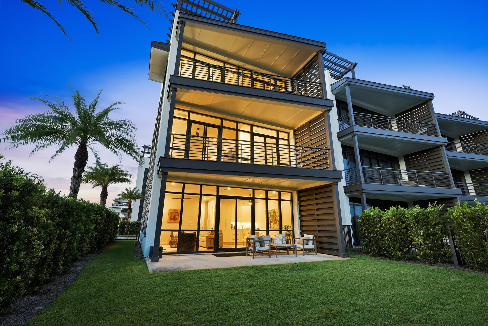 Set within a private gated community in the heart of Blue Mountain Beach, 2228 W County Highway 30A presents a refined expression of coastal living, pairing Gulf views and generous outdoor spaces with thoughtfully appointed interiors. Spanning 3,507 square feet, this four-level residence offers five bedrooms, five-and-a-half bathrooms, an elevator, multiple balconies, and a rooftop retreat designed to make the most of its exceptional 30A setting.

Inside, a sense of understated elegance unfolds through light-filled living spaces and a floor plan created for effortless connection between gathering, dining, and relaxation. The custom kitchen serves as a sophisticated centerpiece, featuring beautifully crafted cabinetry, a Thermador range, Sub-Zero refrigerator, and elevated finishes that balance form with everyday function. Each of the five bedrooms is an en suite, offering a private, well-appointed retreat on every level.

Outdoor living is woven throughout the home. Multiple balconies invite fresh Gulf breezes and views toward the water, while the fourth-floor rooftop deck creates a memorable setting above it all. Complete with a grilling area and dedicated spaces for dining and lounging, it is equally suited to morning coffee, sunset dinners, and evenings beneath the coastal sky. The property extends its thoughtful design beyond the interiors with a fenced yard, two-car garage, and separate storage garage, providing valuable space for beach gear, bicycles, and the essentials of life along 30A. An elevator connects the home's levels with ease.

Community amenities further enhance the experience, including a large resort-style pool and hot tub complemented by a private owner cabana--an inviting extension of the home's outdoor lifestyle.

Perhaps most compelling is the location. From this coveted stretch of Blue Mountain Beach, dining, shopping, and public beach accesses are all within walking distance, placing the rhythm of 30A just beyond your door while providing a private setting to return to at the end of the day.

With its Gulf views, expansive rooftop living, sophisticated kitchen, en suite accommodations, and exceptional proximity to the best of Blue Mountain Beach, 2228 W County Highway 30A captures a polished yet relaxed approach to life on the coast--where thoughtful design and a remarkable sense of place come together beautifully.