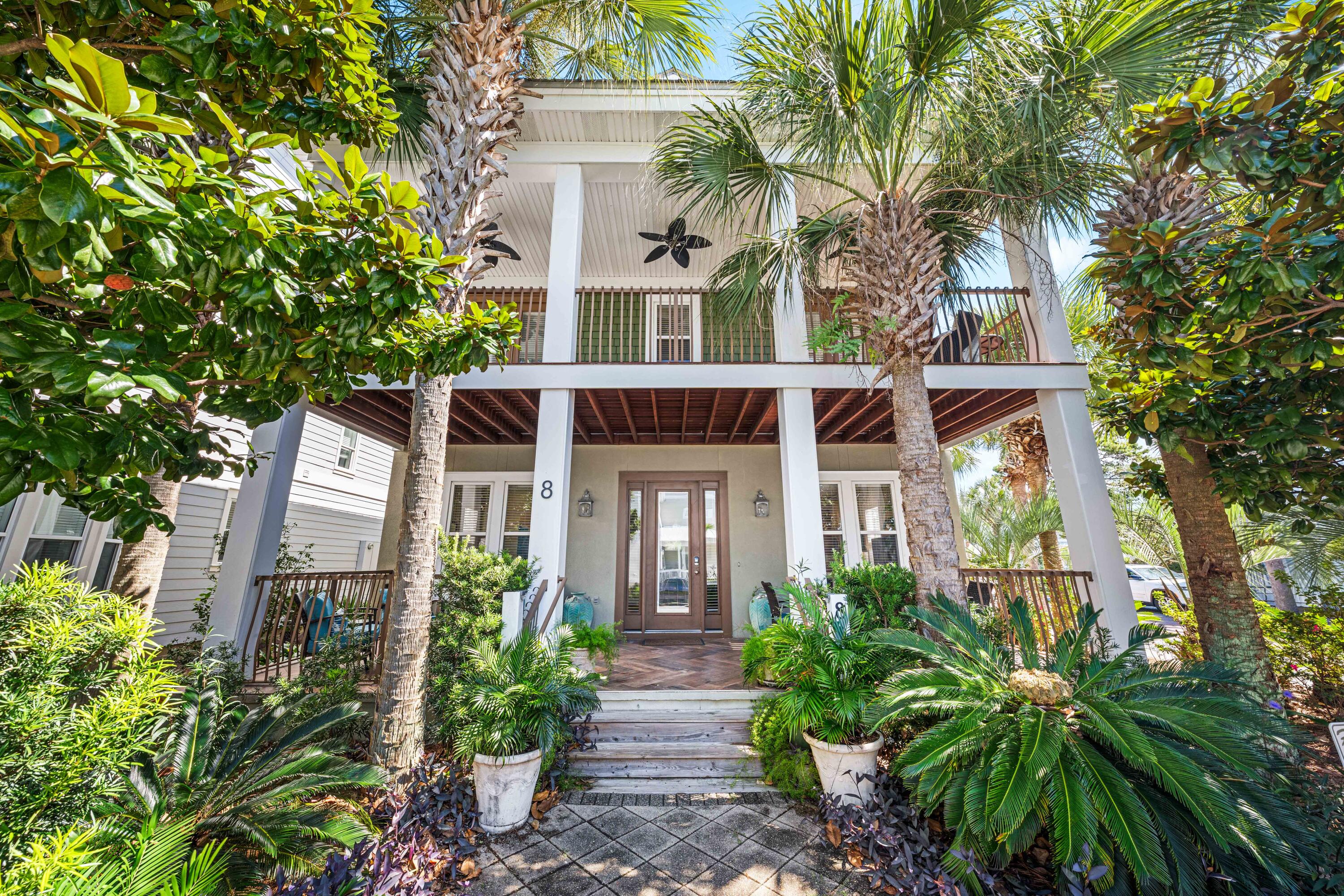Positioned on a corner lot and enveloped by lush, mature landscaping this four bedroom beach house has expansive porches that invite you to slow down and relax. 
Upon entering the home you will be greeted by a light filled, generous open concept living that can accommodate your entire family.  
The second floor is host to the primary bedroom along with two guest bedrooms. An additional guest bedroom is located on the first floor. 
Wood finish flooring throughout the house and all of the bathrooms have been fully remodeled. 
The backyard offers a special opportunity to imagine and create the outdoor space of your dreams, whether it be a carriage house, water feature, or garage. The vision yours.