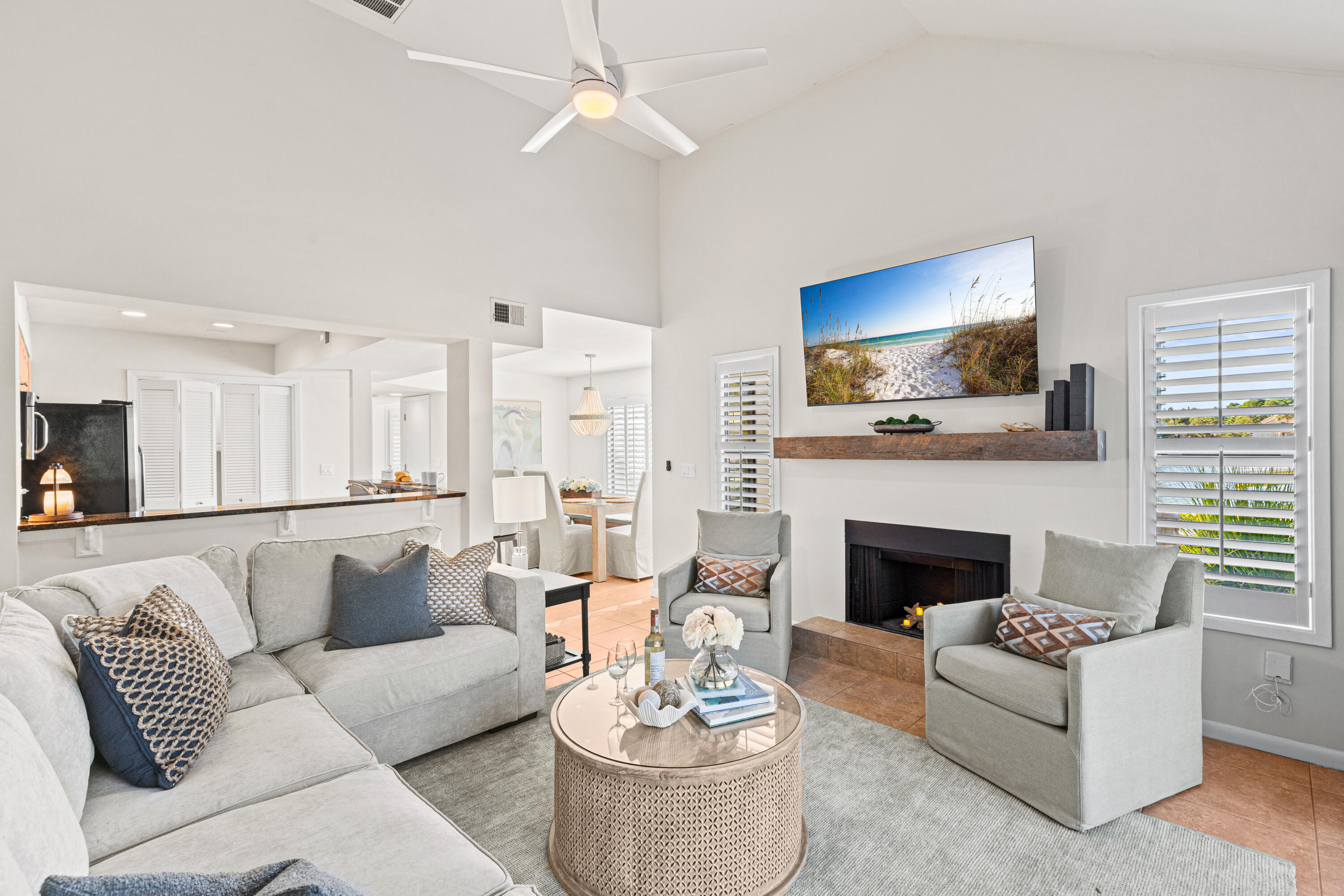 Experience the Mediterranean-inspired lifestyle in this beautifully updated 2-bedroom, 2-bath corner townhome. This residence features a new roof (2024), fresh exterior and interior paint, a new water heater (2025), and remodeled bathrooms. Spanning 1,421 square feet, the interior is styled with Coastal Luxe decor and filled with natural light, vaulted ceilings, updated flooring, and elegant plantation shutters. The spacious floorplan includes a first-floor primary suite with a private outdoor courtyard and modern finishes in the ensuite. The second floor offers another primary bedroom plus a versatile loft area featuring two twin beds for additional sleeping and an entertainment. Relax on your patio with stunning lake views or take the included golf cart for a short ride to the beach. As a special welcome, the buyer will receive a lifestyle package including tennis court time and golf rounds at Sandestin's championship courses, including the exclusive Burnt Pine Golf Club. Enjoy world-class amenities and entertainment  in this gated paradise. As an introduction to the Sandestin lifestyle, we invite our new owners to explore amenities that make Sandestin special. The listing brokerage and seller(s) are presenting the buyer(s) of this property with (2) 90-minute rounds of Tennis court time, a golf foursome at one of our three championship courses, and a round of golf for up to four (4) players at the unrivaled Burnt Pine Golf Club.  Sandestin Golf and Beach Resort features more than seven miles of beaches and pristine bay front, four championship golf courses, 15 world-class tennis courts, a 226-slip marina, a fitness center, spa and celebrity chef dining. Shop, dine and play at the charming pedestrian village, The Village of Baytowne Wharf and more. Inside the gates of the resort, residents enjoy a balanced lifestyle of high-class living, spanning the 2,400 acres from the beach to the bay. Everything within the gates of the resort is accessible by golf cart or bicycle. The entire resort is interconnected by miles of pedestrian, bike and golf cart paths that weave through groves of live oaks, meandering past natural lagoons, fountains, man-made lakes, and meticulously landscaped fairways.