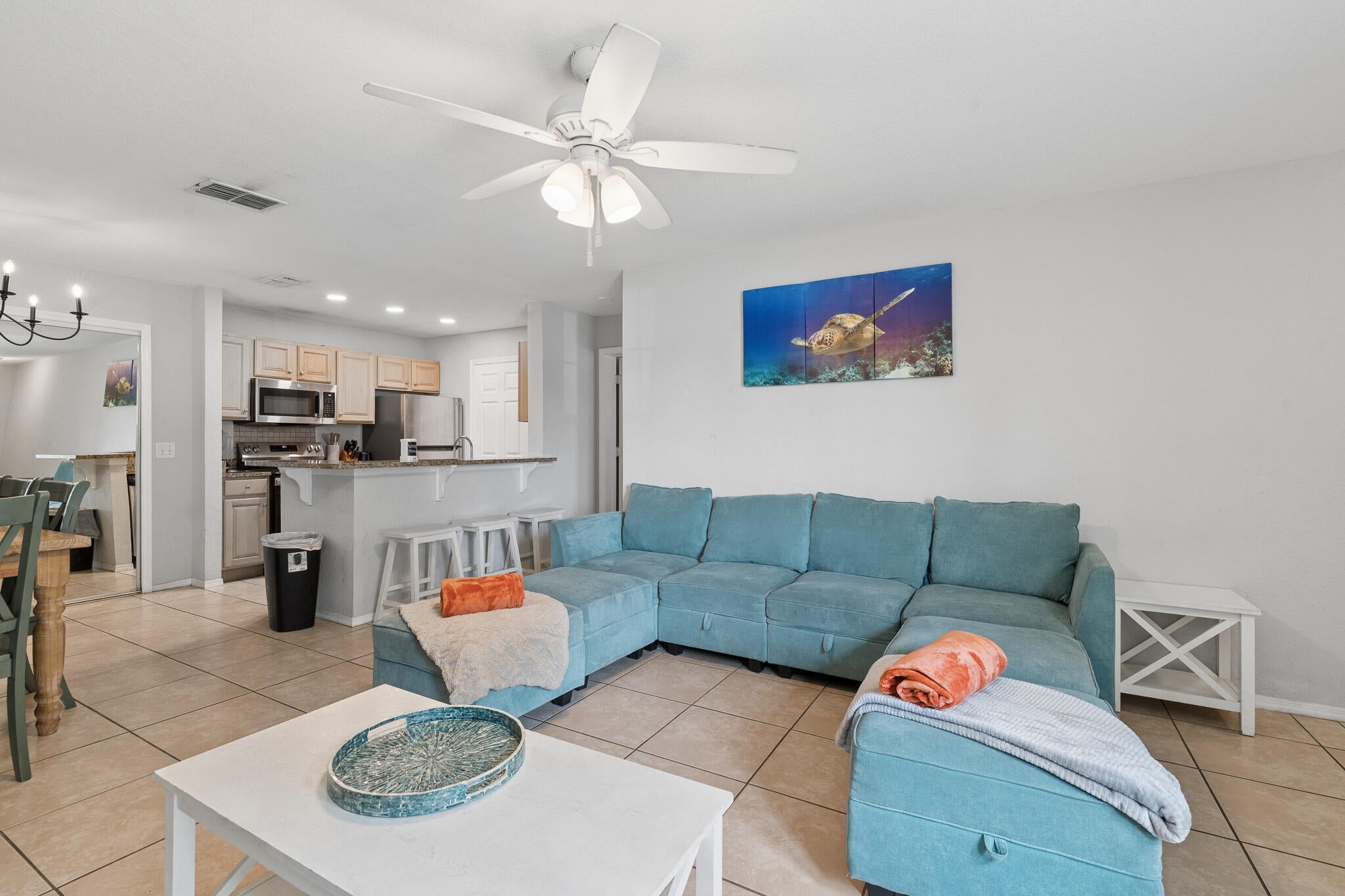 Rare opportunity to own a spacious 4-bedroom, 3-bath condo in the highly desirable Nautilus Cove community, located just one mile from the sugar-white sands and emerald waters of the Gulf. This coveted first-floor unit is one of only a select few within the community that allows short-term rentals, making it an exceptional investment opportunity, second home, or full-time residence. Estimated rental projections range from $66,000 to $86,000 annually. The thoughtfully designed floor plan offers plenty of space for family and guests, while residents enjoy gated access and resort-style amenities, including a community pool, fitness center, clubhouse, and playground. Conveniently located near shopping, dining, entertainment, and Panama City Beach attractions, this property offers the perfect blend of coastal living, convenience, and income potential. If measurements deemed important, please verify.