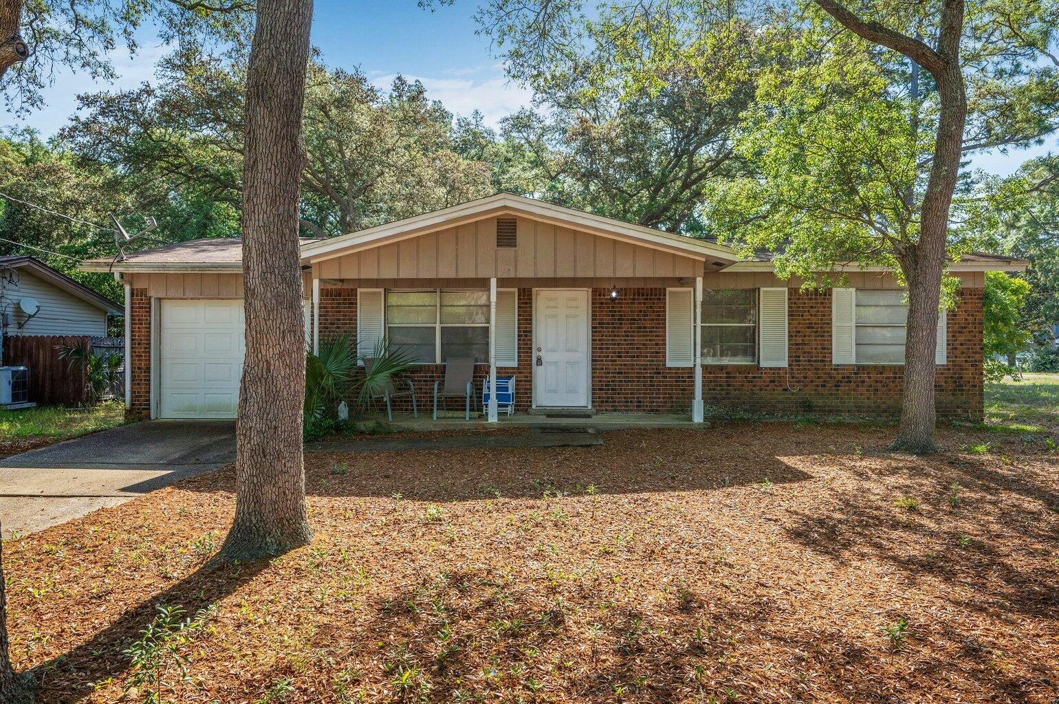 Short Sale- Three bedrooms and one half bath on large corner lot.