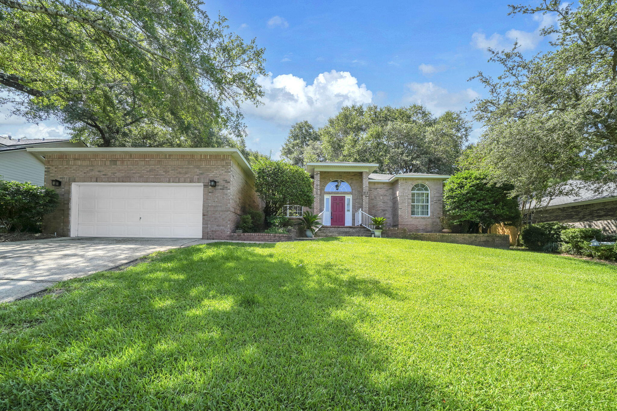 Sellers will consider all reasonable offers!  Price Just Reduced by 50K!!  Located within the highly sought-after gated community of Parkwood Estates, this one-owner home offers 2,558 square feet of thoughtfully designed living space with 3 bedrooms and 2 full bathrooms. Built in 1992, this exceptional residence is complemented with a spacious, functional floor plan.  The soaring 10-foot ceilings that create an open and inviting atmosphere throughout the home. The layout features a spacious foyer, formal dining room and living room perfect for entertaining, a spacious family room with a cozy gas fireplace, and a large utility room with plenty of storage and workspace.  The heart of the home is the expansive kitchen, complete with a center island, breakfast bar, abundant cabinetry, and a sunny breakfast nook overlooking the backyard, perfect for everyday living and gathering with family and friends.  Situated on a .29 acre lot, the property is surrounded by mature trees that provide beauty, shade, and privacy.  Parkwood Estates is one of Bluewater Bay's premier gated neighborhoods, offering a desirable location just minutes from Bluewater Elementary School, golf courses, shopping, dining, parks, and the Mid-Bay Bridge for convenient access to Destin, Eglin Air Force Base, and Duke Field.  Roof 2014, A/C and HWH are both newer.