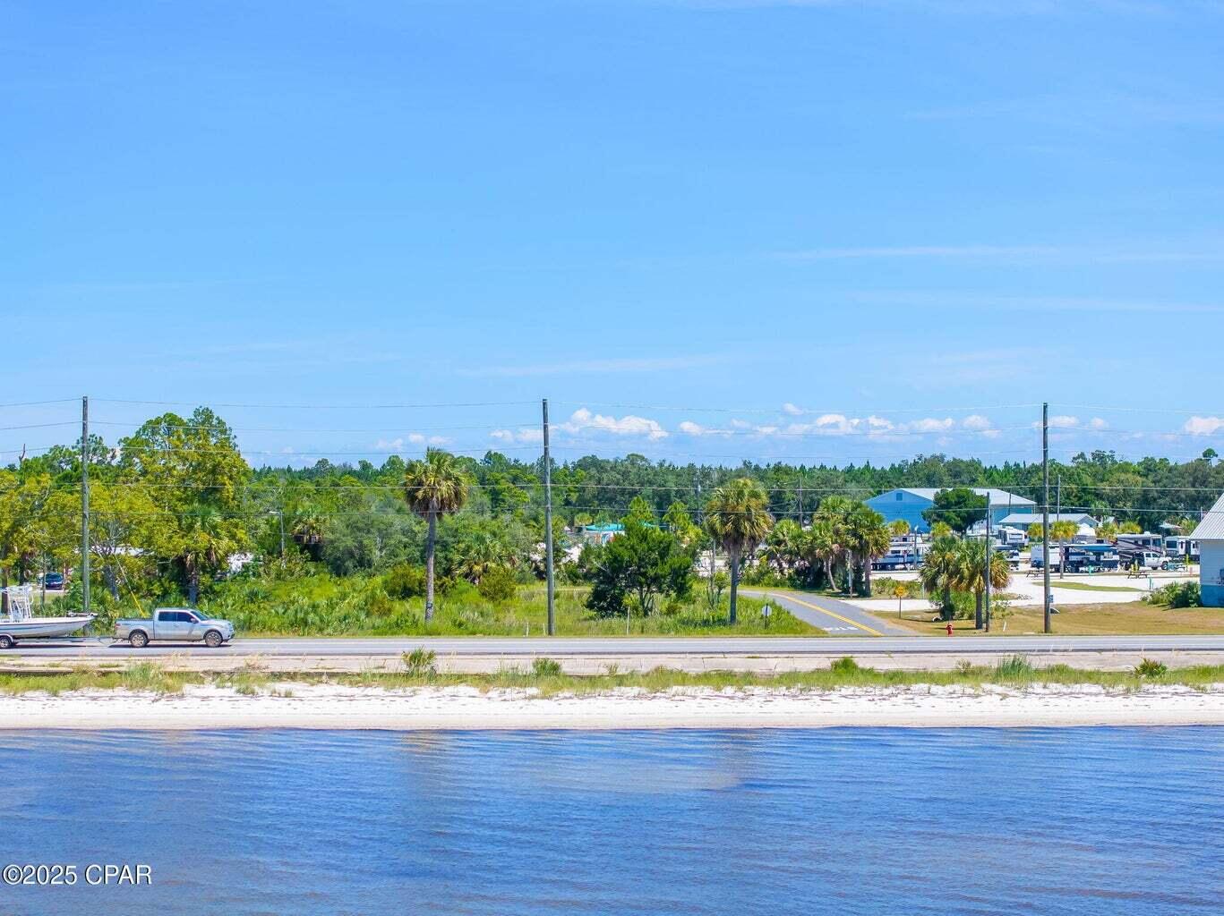 Discover the potential of this versatile property located in the heart of Port St. Joe, directly across the street from St. Joe Bay. This is currently one parcel with the flexibility of being able to divide the parcel into two lots. Whether you're seeking an RV site, investment opportunity, or the perfect spot to build your coastal retreat, this parcel delivers. Property Highlights: Zoning Flexibility - Up to 2 habitable dwellings per parcel (or 1 dwelling if left undivided), RV friendly - 1 RV allowed per parcel, Set. Setbacks: Structures under 25' - 7'6'' setback, Structures over 25' - 9'6'' setback. Flood Zone AE10; This property is situated in a peaceful coastal neighborhood with convenient access to nearby beaches, boat launches, and the charm of downtown Port St. Joe. With room to design your dream home-or even multiple dwellings-this lot provides incredible flexibility for personal use or investment. Build your future along Florida's Forgotten Coast. *All measurements and information approximate, please verify if important.
