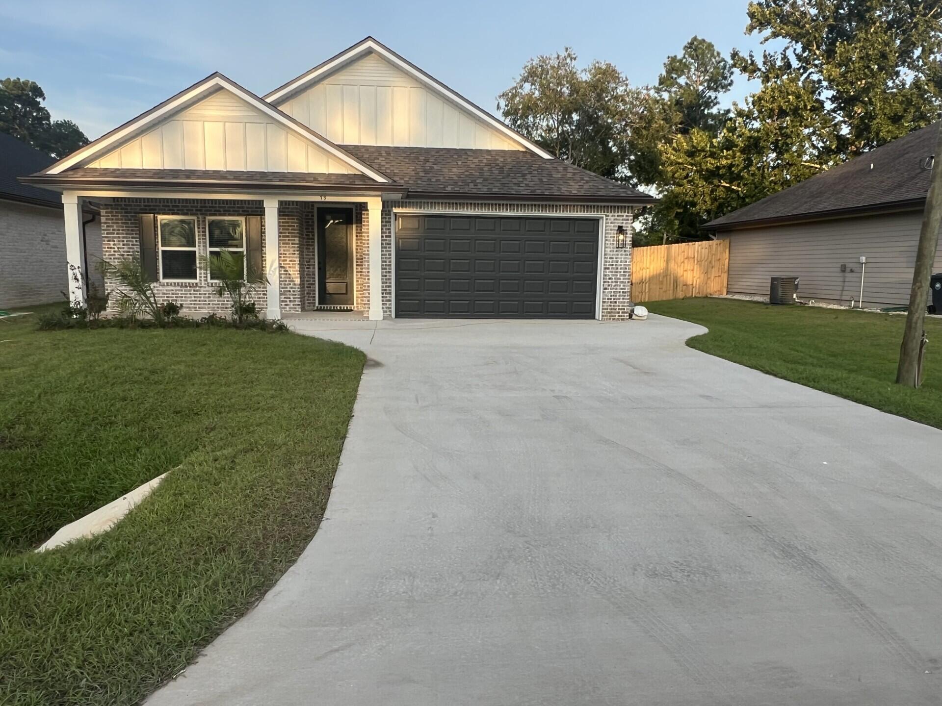Stunning craftsmanship in this new construction all-brick 3-bedroom, 2-bath home sitting on a corner lot. $10,000 towards buyers closing cost. This modern home features 1,905 sq.ft. with high-end custom finishes, and exceptional detail throughout the home.  Come get settled into a neighborhood less than 2 miles East of Bluewater Bay and the Mid-Bay Bridge surrounded by new construction! This home blends timeless quality with today's most desired features, creating a home that is as functional as it is beautiful. Entering the home, you have an oversized foyer that immediately sets the tone for the custom finishes found throughout. Premium LVP flooring throughout the entire home, paired with crown molding and reverse trey ceiling with lighting, providing a seamless aesthetic.  Enter into the spacious living room with an open concept that provides an abundance of natural light with high impact windows, neutral finishes and modern lighting. Additional features include a floor outlet in the family room, perfect for floor plugs, lamps or phone charges without obstructing walkways. The kitchen is a Show Stopper, designed with both style and functionality. Featuring white shaker cabinetry with soft close doors, a farm sink, white ceramic back-splash, quartz countertops, stainless steel Whirlpool appliance package and a large walk-in pantry. The oversized 8ft island and the 6ft coffee bar add the perfect finishes! As you enter the spacious primary suite, you're greeted with natural light and you'll love the reverse trey with custom changeable lighting. Especially in the evening! The spa-like bathroom is beautifully accented with a 6ft soaking tub with shiplap accents, custom led lighting behind the mirrors with changeable colors. A custom-built full-length mirror and the spa-like shower features a built-in bench, rain head, front sprayer and a handheld sprayer conveniently placed beside the bench. Custom shelving makes the walk in closet perfect for organization. This split floor plan provides two more bedrooms and another full bath. Laundry, you will actually want to do the laundry, with a custom folding table with quartz countertop, and built-in shelving. When you want to relax, and rewind, the back yard is the place! You'll enjoy a screened in porch with ceiling fan, flood lights on each end of the house and an extra paver pad across the back of the home for a full patio set and grill. Maintenance is easily obtained with this fully sodded yard, sprinkler system that works off a separate well and a 6 ft. privacy fence with gutters installed. Theres an alley road for these homes that give an entrance to the back yard as well. A double gate has been installed on the back right side, ideal for ATV's, jet ski or a trailer. For energy efficiency, the builder has installed upgraded spray foam in the roof. You will also enjoy the storage above the garage along with the upgraded epoxy garage floor. This builder takes great pride in his homes and it shows! Five new homes are under construction. The builder is offering $10,000.00 towards the buyers closing cost, doc stamps on the deed, split title insurance and all title related fees. Restaurants, boat launch, Eglin Air Force Base, Special Forces, Emerald Coast beaches, shopping, hospitals and more are very close. Call today for a viewing, and Welcome Home!