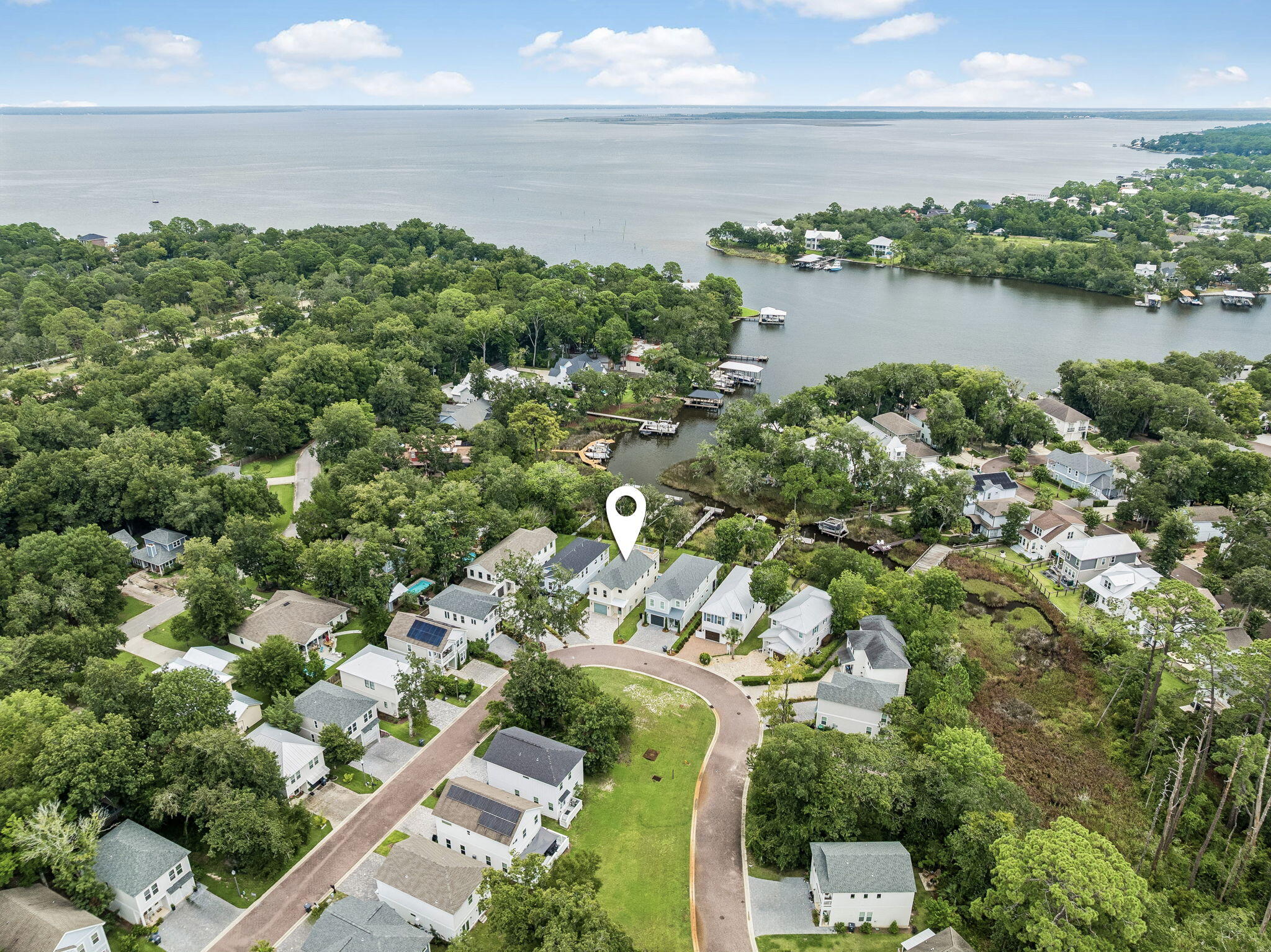 Welcome to this new construction home at 168 Rearden Way that features a pool, elevator, and private dock. Located in Sacred Oaks, this is where waterfront living and timeless Old Florida charm come together. Completed in July 2026, this home sits along the bayou, where the water sets the pace for everyday life. Launch a paddleboard or kayak from the community dock, fish from your private dock, or simply unwind as the light changes across the water at the end of the day. Offering 2,350 SF, 3 bedrooms, and 2.5 bathrooms, the home is thoughtfully designed to take full advantage of its waterfront setting, with water views from many of its living spaces. From the moment you step through the front door, it's clear the details weren't treated as an afterthought. Every finish was selected with purpose, and the craftsmanship speaks for itself. Anchored by Thor appliances, the kitchen opens effortlessly into inviting gathering spaces where thoughtfully selected finishes create a warm, welcoming atmosphere.

Built with enhanced exterior wall construction for added strength, the home also features impact-rated windows and a private elevator, blending lasting quality with everyday comfort and thoughtful practicality.

Outside, the waterfront lifestyle continues with a heated pool, a private dock, and a rooftop deck spanning the full width of the home. Whether you're enjoying morning coffee, taking in the coastal breeze, or watching another unforgettable sunset over the water, every space was designed to make the most of the setting. It's the kind of place where the view never really gets old, and the days naturally slow down once you get home.

Contact us today to schedule your private tour.

All information is deemed reliable and provided for informational purposes; buyers are encouraged to independently verify all details.