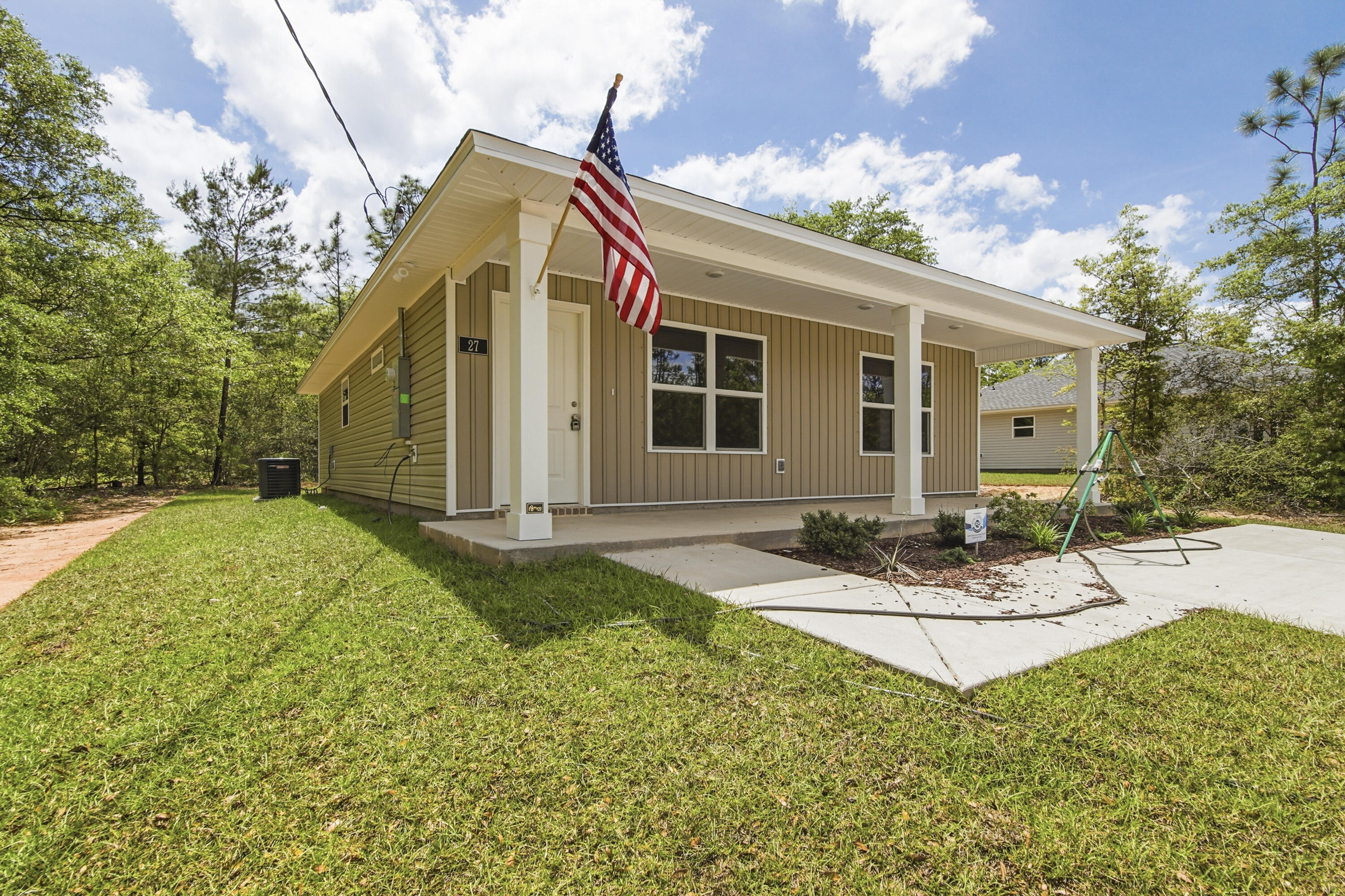Fresh, simple, and easy to love. This newly built home by Flynn Built with NO HOA welcomes you with an expansive front porch , offering 2 beds and 2 baths with a light, open layout that feels comfortable and livable. Inside, you'll find durable LVP flooring throughout, granite countertops, stainless appliances and a bright, airy feel that makes the space live larger than expected. The exterior features low-maintenance vinyl siding, making upkeep. Also included is a one-year builder warranty for added peace of mind. Plus, with a full-price offer, buyers receive $6,000 toward closing costs, making this a super option for first-time buyers, those downsizing, or anyone looking for a clean, move-in ready start.