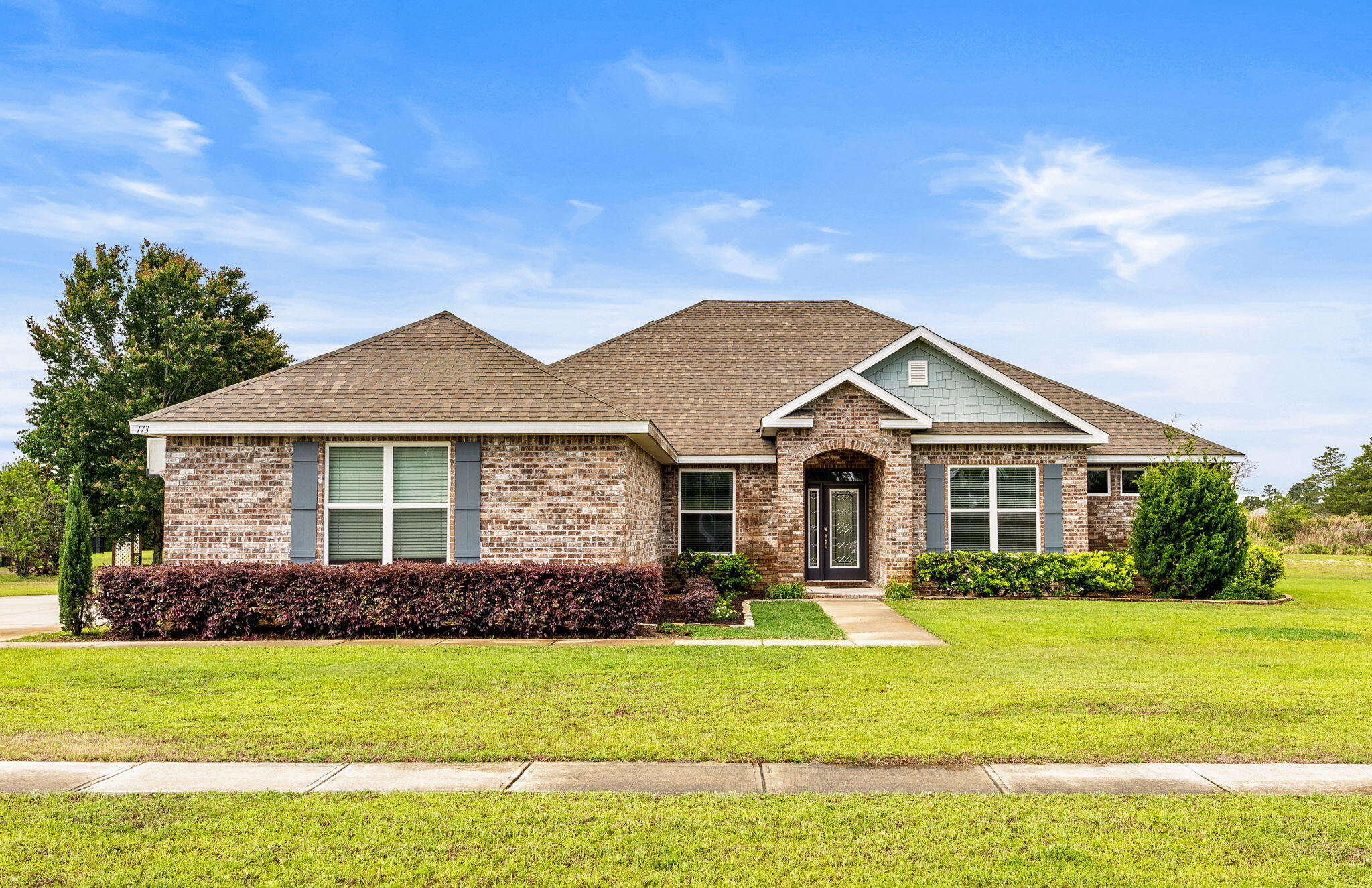 Welcome to Windswept Estates! This expansive 4 bedroom (plus formal dining and flex rooms), 3 bathroom, beautiful brick home on nearly an acre, sprawling across 3,058sf is ready for you! Drive up in your large driveway enough to accommodate many vehicles and great area for play time or hanging out. Take a step to the front porch passing by the lush landscaping with inviting entry. Once inside you will immediate feel the warmth of the large entryway. tall ceilings and open floor plan. Large windows bring in natural light to the kitchen and living room, while the stainless steel appliances, walk in pantry and large island offer culinary perfection. The primary suite offers a beautiful ensuite featuring separate vanity sinks, garden tub and walk in glass door tiled shower. The other three bedrooms are spacious and are complemented with two full bathrooms to accommodate your family and/or guests. Enjoy the covered patio overlooking your large backyard, sitting off hole 1 at Windswept!

Windswept Estates amenities include a community pool, basketball, pickleball and playground. There is also an 18 hole championship golf course that is available to play for an additional cost and open to the public. Pets allowed, restrictions apply. If approved, a one-time $250 non-refundable pet fee and $25/mo pet rent, per pet applies. A one-time $100 lease admin fee applies to all new leases.