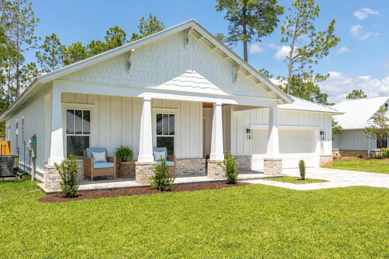 NEW CONSTRUCTION 3 bedroom, 2 bath almost 2,400 Sq Ft resort style home in the prestigious, gated community of Bear Creek! Hurricane rated windows and doors. Nestled on a prime lot in Phase I and surrounded by serene green space. This home is steps from the newest amenity center . Bear Creek residents enjoy amenities including pickleball, tennis, basketball courts, a fitness center, and a resort-style pool. Construction is near completion on the second pool and four more pickleball courts. Bear Creek is minutes from the Beaches of South Walton and parks.