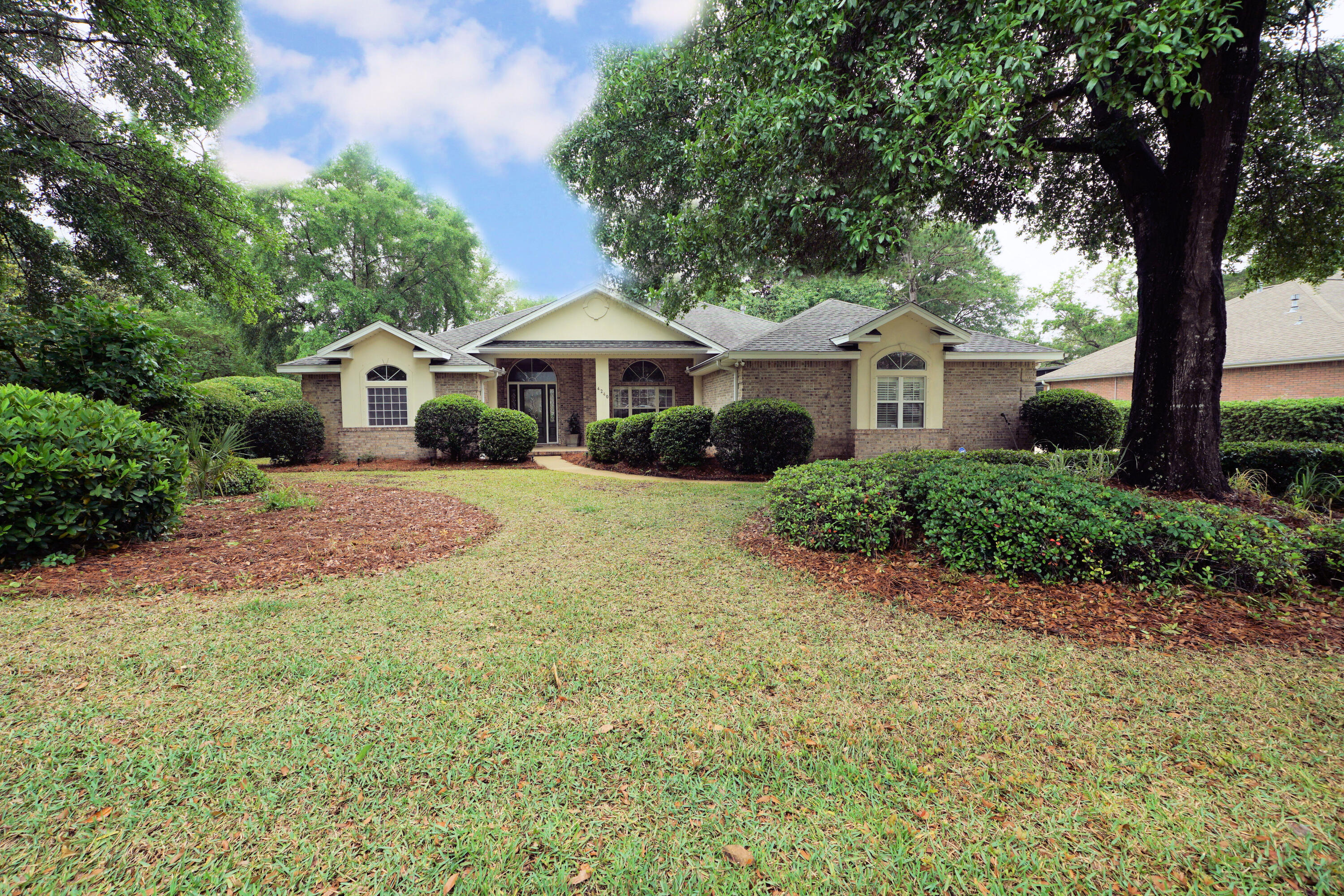 Seller is offering $10,000 towards closing cost's Welcome to this beautiful 4-bedroom, 3 bath home located in the gated Bluewater Bay community of Magnolia Plantation.  Updates include roof (2017), HVAC (2017), tankless water heater (2018), and fresh interior paint including trim and doors.  This split-bedroom floor plan features hardwood floors, a spacious family room with gas fireplace and built-in bookcases, formal dining room, and large living area overlooking the screened pool.  The kitchen offers upgraded cabinets, Corian countertops, black appliances and a breakfast nook.  Spacious primary suite includes dual vanities, dual walk-in closets, garden tub, and walk-in shower.  Outdoor entertaining is easy with the screened pool area visible from multiple rooms.  Community amenities include golf, tennis, pickleball and marina access.
