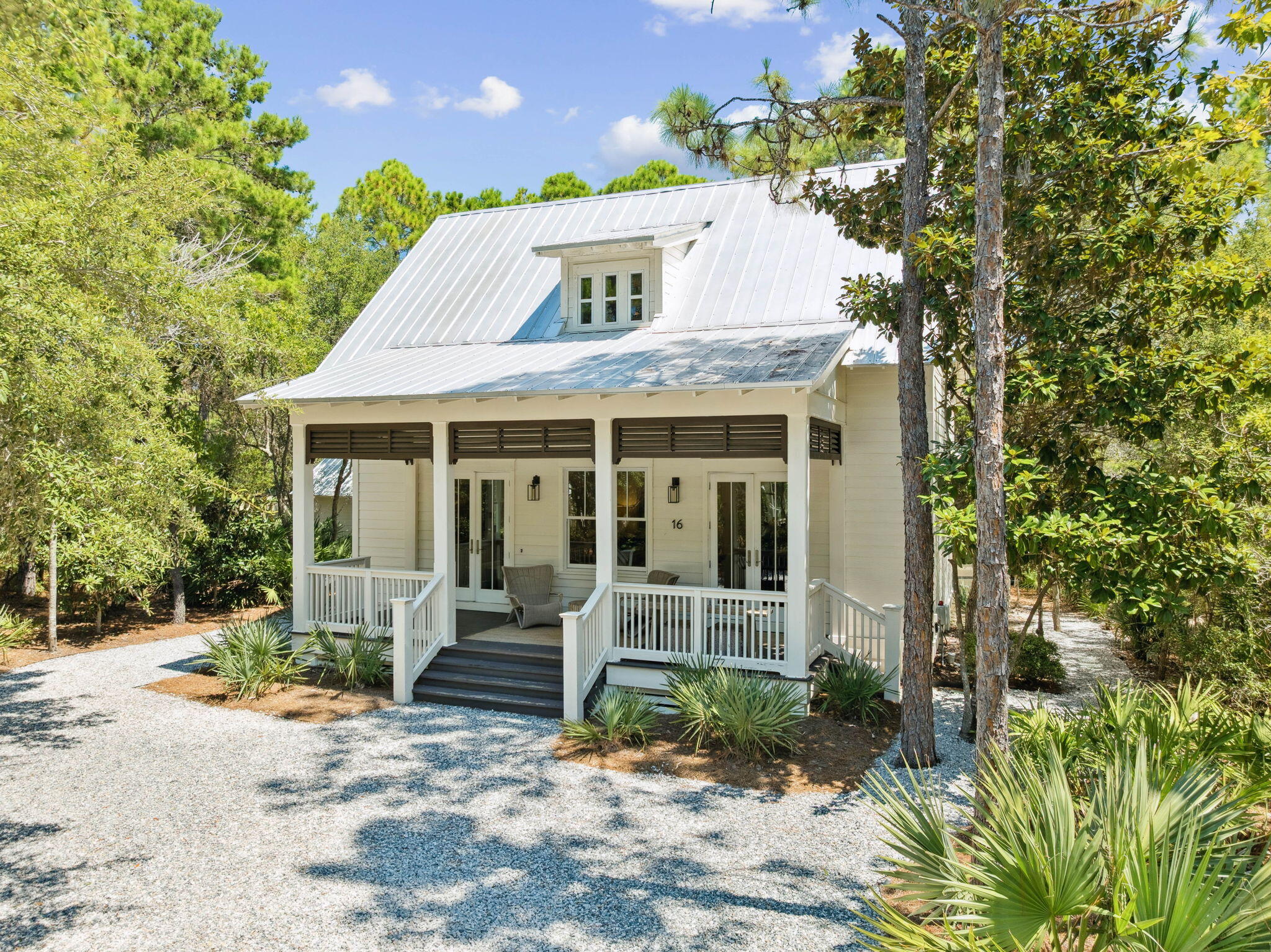 Located in the gated community of The Hammocks at Seagrove Beach, 16 Bosk Lane is a beautifully designed 3-bed, 3 bath, 2,088sqft home featuring an open floor plan and spacious screened porches perfect for enjoying the coastal breeze. The home offers a a large kitchen with abundance of counter space and generous storage, making it ideal for both everyday living and entertaining. The backyard is thoughtfully arranged for outdoor enjoyment, featuring a comfortable lounge area, dedicated dining space, charming hammock, and a garden shed for added storage and convenience. Situated on one of the largest lots in the neighborhood, the property offers ample parking, room to add a private pool or the outdoor kitchen of your dreams. Residents enjoy access to two community pools and a prime location just minutes from Publix, Seaside, WaterColor, and the heart of Seagrove.