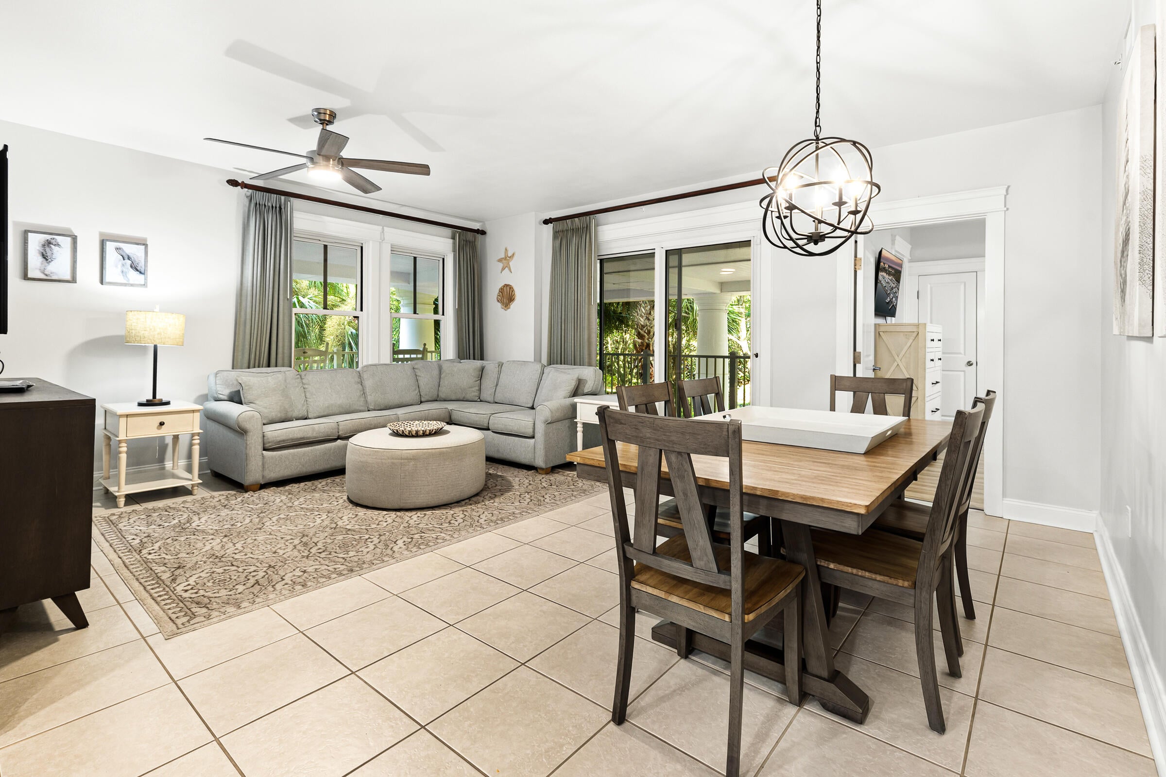 This beautifully furnished 2nd-floor corner residence at Grand Sandestin offers extra privacy, abundant natural light, and a spacious wraparound covered balcony overlooking lush gardens and the resort-style lagoon pool. Whether you're searching for a vacation retreat, investment property, or both, this condo is ready to enjoy from day one. Inside, you'll find tile flooring throughout the main living areas, brand-new luxury vinyl plank flooring in both bedrooms, and a bright, open layout designed for easy coastal living. Simply unpack your suitcase--or begin welcoming guests immediately. 

Just outside your door, the vibrant Village of Baytowne Wharf invites you to enjoy waterfront dining, boutique shopping, and a calendar full of festivals, concerts, and family-friendly events. Grand Boulevard is just minutes away with upscale dining and retail favorites like Publix, Bricktops, Fleming's, and more. Sacred Heart Hospital is a short golf cart drive from the resort, and Destin-Fort Walton Beach Airport (VPS) is conveniently located just 30 minutes away.