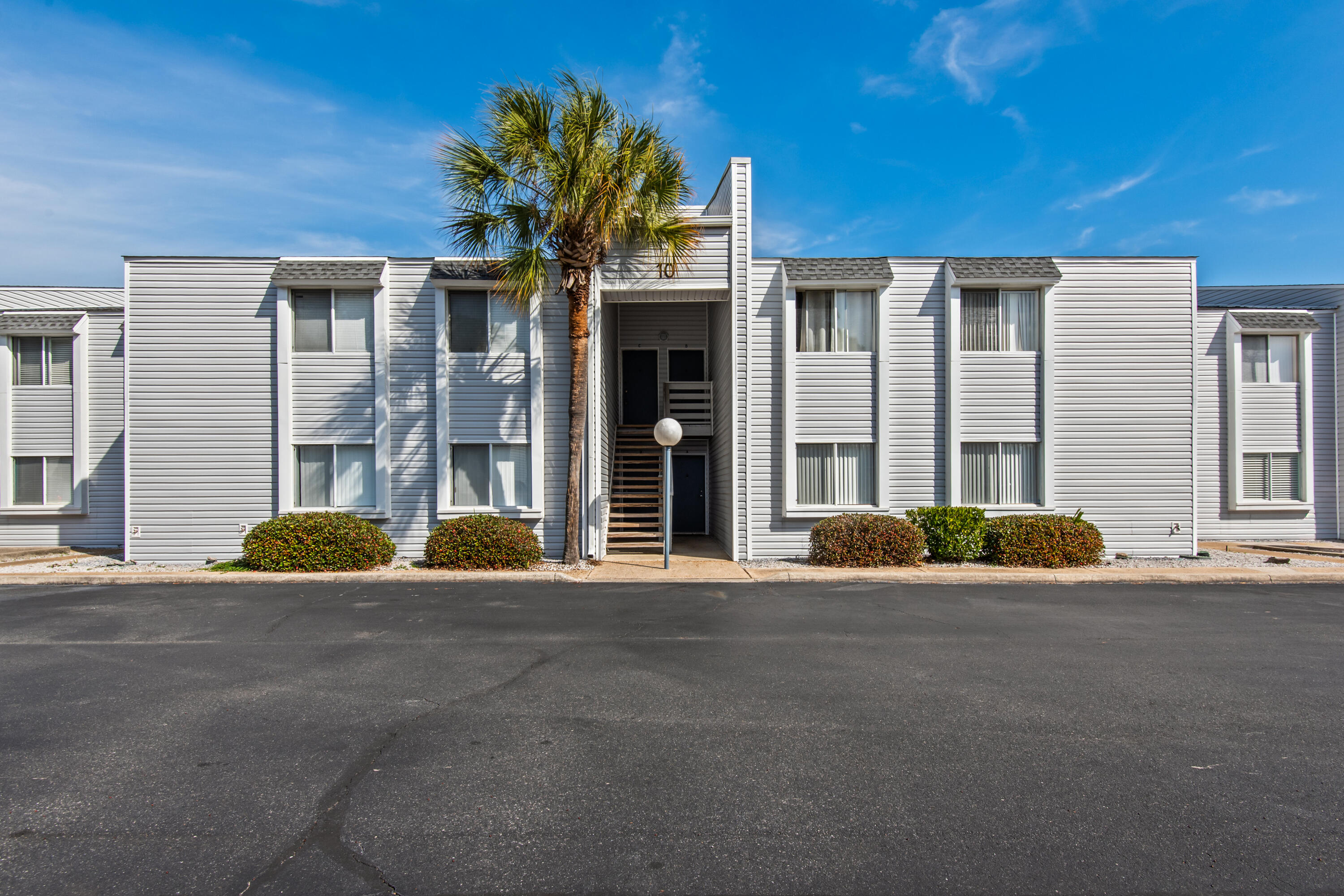 Welcome to Unit 10B at Finisterra in Shalimar--a beautifully maintained first-floor, 2-bedroom, 1-bath condo offering easy, low-maintenance living in a gated bayfront community. Residents enjoy an array of waterfront amenities, including a pool, tennis and pickleball courts, and direct water access for fishing or launching a paddleboard or kayak. Peaceful sitting areas and scenic walking paths create the perfect setting to relax and unwind. The complex is well maintained and was recently updated with all new roofs and siding in 2023. This unit features beautiful wood flooring and has been recently painted. Conveniently located near Eglin AF Base, Destin-FWB Airport, shopping and the area's stunning beaches. Come see it today!