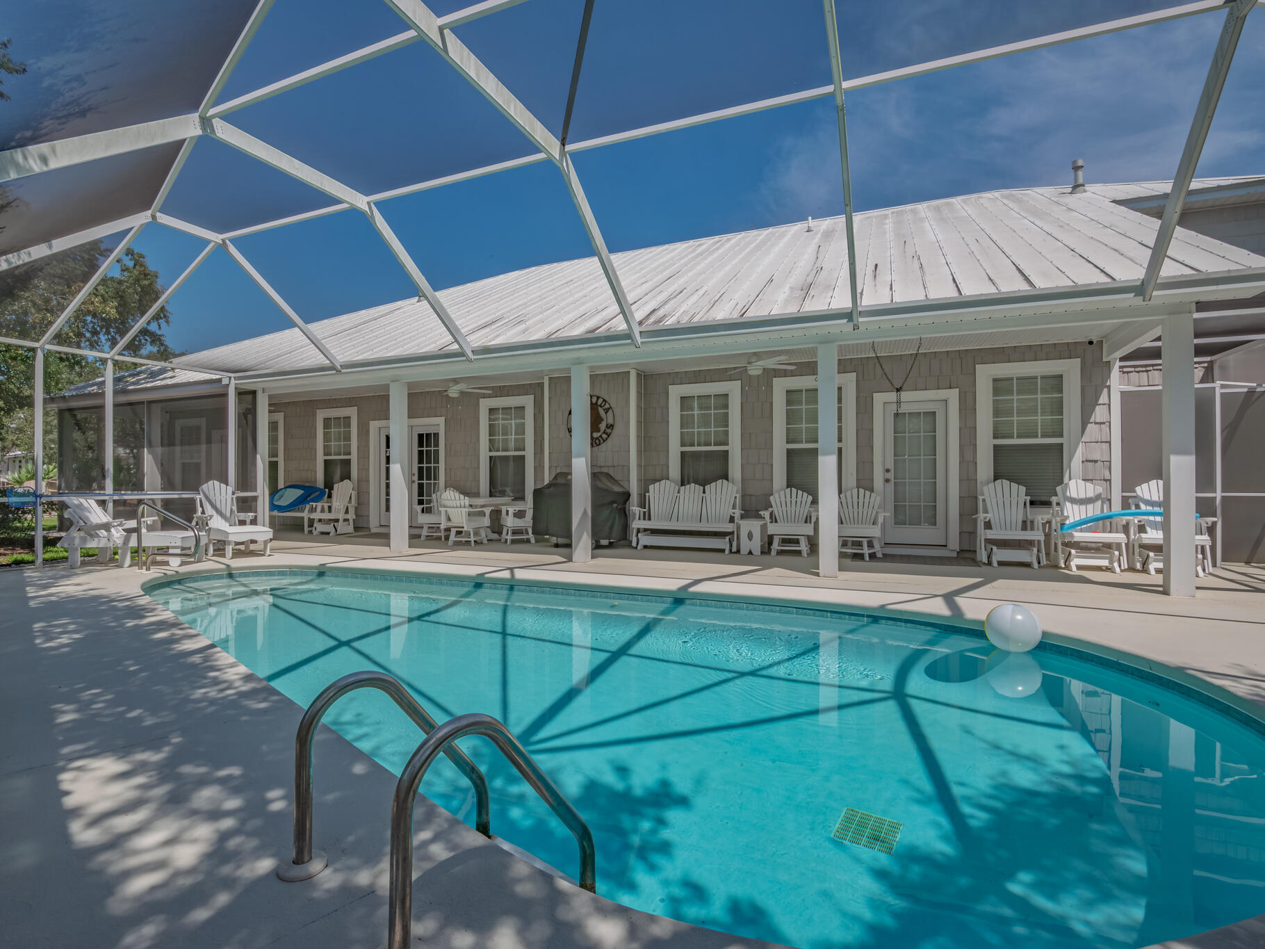 This beautiful one-level beach retreat sits just off of 30A with TWO beach access points (including a private deeded access), and lake access. You're just steps from the sugar-white sands of 30A.   Fully updated in 2019, Truly a property that must be seen to be appreciated. Featuring 3 spacious bedrooms, 2.5 baths, plus a versatile room that can serve as a 4th bedroom or office, this home also includes a climate-controlled flex space off the garage, perfect for a gym, or additional living area.  Set on nearly 1/2 an acre, the private fenced backyard is designed for relaxation and entertaining, complete with a fire pit, heated screened-in saltwater pool, and outdoor shower. EXTRAS: 2-car garage, Whole house generator, Walkable location to shops, dining, Alys, and Rosemary Beach.
