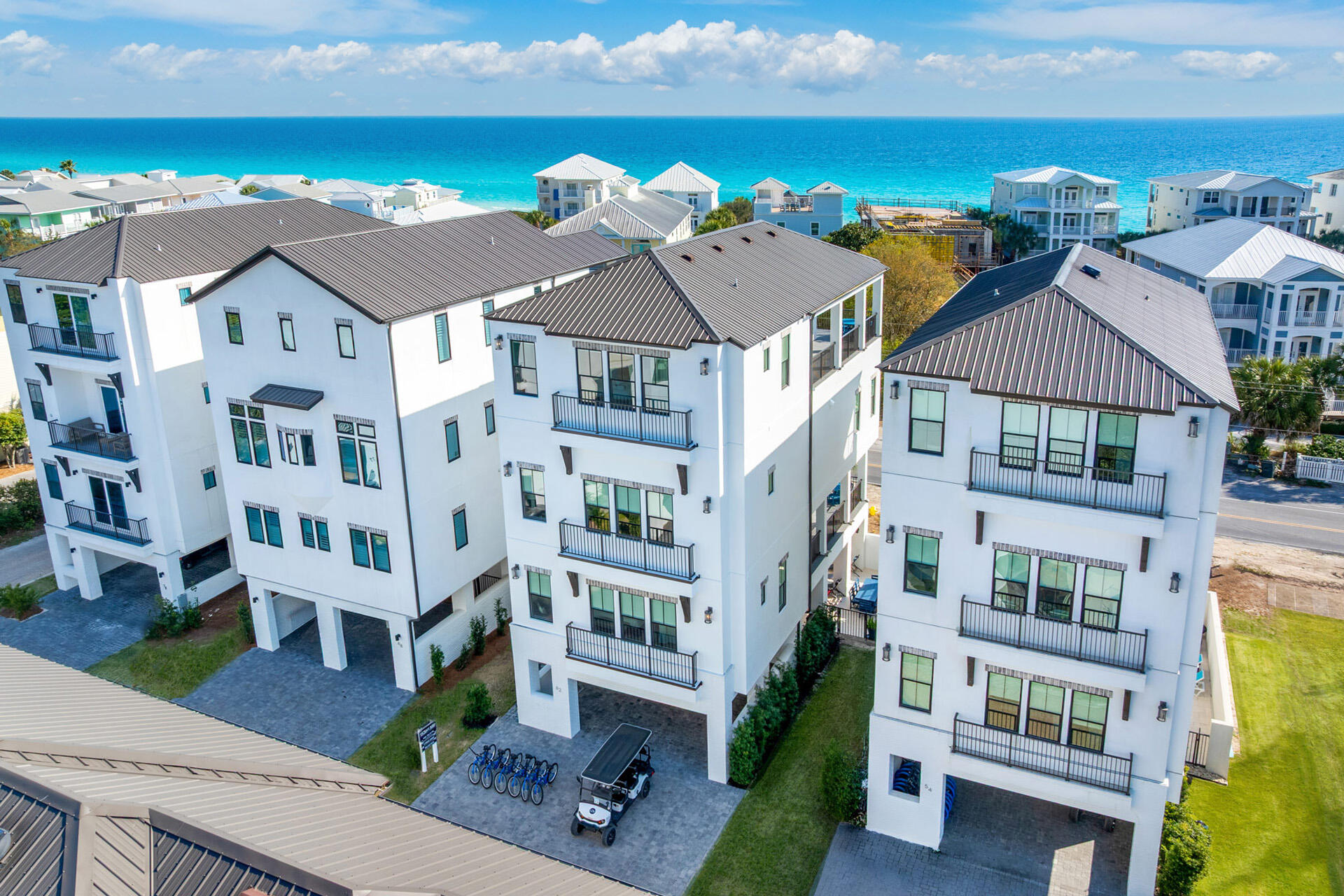 Welcome to 62 Cote D' Azur~Exceptionally posititioned between the two busy communities of Alys Beach & Seaside lies the quiet but desirable community of Seagrove Beach beloved for its relaxed, natural character and timeless beach-town charm. This seven-bedroom, eight-bath residence captures the essence of the classic Florida beaches--sunlight, salt air, and space for everyone you love to gather. A slice of paradise with PRIVATE DEEDED ACCESS to the beautiful sun-soaked Emerald Coast just a few steps away. From the moment you arrive, the home's presence feels effortless yet purposeful. Wraparound porches on both the main and upper levels stretch outward like open arms, inviting slow mornings with coffee and the soft sound of Gulf breezes drifting through the palms. It's a design that honors coastal living and the simple luxury of lingering outdoors long after sunset. Inside, more than 4,000 square feet unfolds with the kind of scale that naturally welcomes groups--extended families, close friends, or generations gathering for beach traditions.  This luxury home has its own elevator, heated pool and is being offered fully furnished, allowing its next chapter to begin immediately--whether as a personal coastal sanctuary or a highly desirable 30A vacation property.