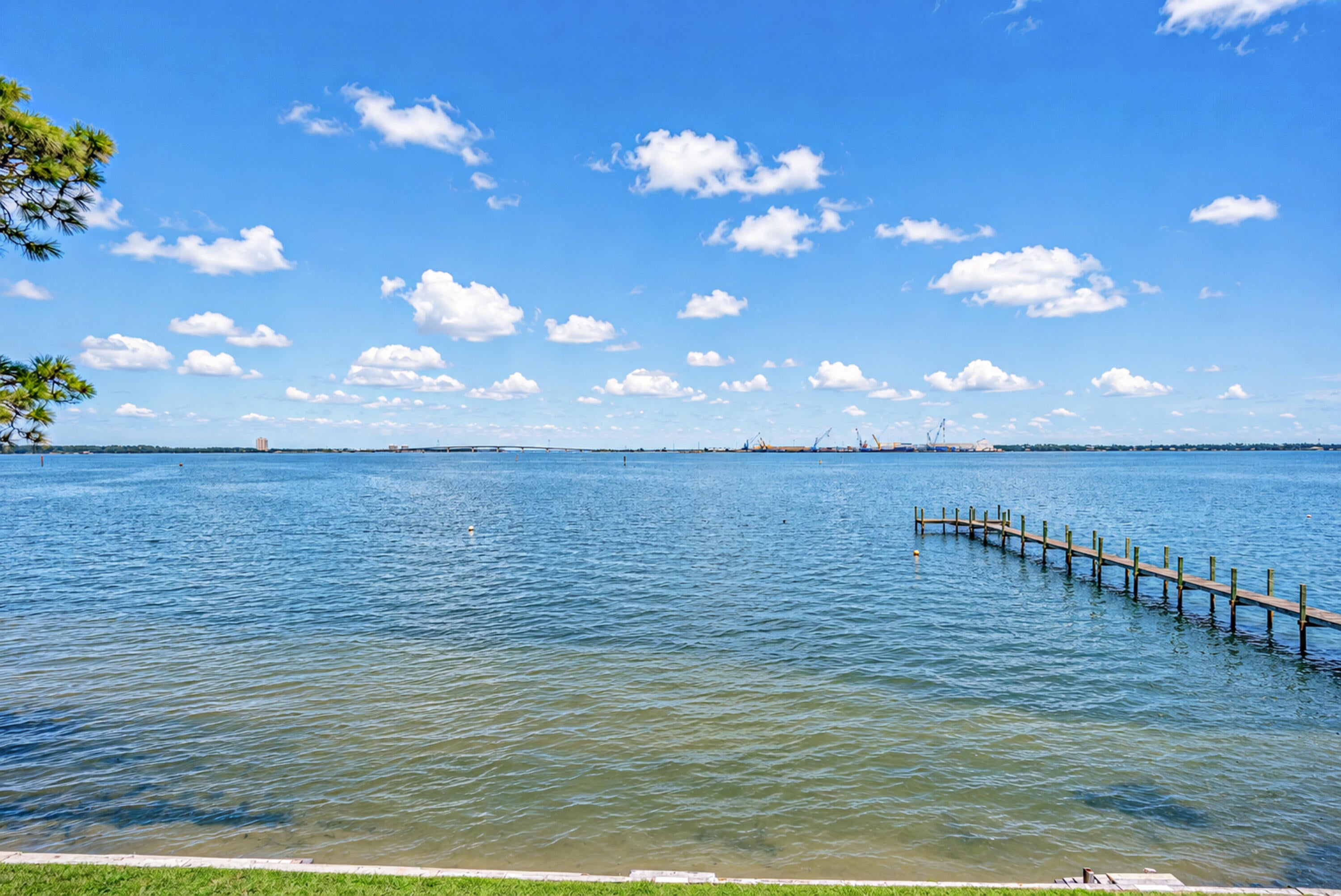 LIVE WHERE THE BAY MEETS THE GULF. Welcome to 2330 Pelican Bay Ct, an exceptional waterfront townhome offering an elevated coastal lifestyle with breathtaking views overlooking St. Andrews Bay and the harbor. Located in the desirable Pelican Bay community, this spacious 3-bedroom, 2.5-bath residence offers 2,357 square feet of beautifully proportioned living space, a private 2-car garage, and an extraordinary setting for those who appreciate life on the water.
From the moment you arrive, the peaceful waterfront setting makes an impression. Inside, the generous floor plan offers an effortless blend of comfort and sophistication, with spacious living areas designed to take advantage of the beautiful surroundings. Natural light fills the home while the bay and harbor views create a stunning backdrop for everyday living. Step outside and embrace the boating lifestyle that makes this property truly special. St. Andrews Bay provides access through St. Andrews Pass to the Gulf of Mexico and Shell Island, putting some of the area's most beautiful waters, beaches, and boating destinations within easy reach. For boat owners, convenience doesn't get much better--you can keep your boat right outside your unit on an anchor buoy, and the community's private dock provides a convenient place to load and unload before heading out on the water. Imagine starting your morning with coffee overlooking the bay, heading out by boat for an afternoon at Shell Island, then returning home to enjoy the sunset from your waterfront porch. This is coastal living designed around the water. The spacious primary suite provides a peaceful private retreat, while two additional bedrooms offer flexibility for family, guests, a home office, or hobbies. Thoughtful improvements provide added comfort and peace of mind, including a new roof and porch in 2019, AC and water heater replaced in 2020, new dishwasher in 2021, and fresh exterior paint completed in 2026. A 2-car garage adds exceptional convenience and storage for vehicles, bikes, paddleboards, beach equipment, and everything needed to enjoy the Florida coastal lifestyle. Beyond your doorstep, Pelican Bay offers a welcoming community atmosphere with a clubhouse and pool, providing the perfect place to relax, entertain, or spend a sunny afternoon close to home. The HOA fee is $1,713 semi-annually. Rentals are permitted with a minimum one-year lease, creating a desirable residential atmosphere while offering flexibility for those seeking a full-time residence, second home, or long-term investment.
And the location puts you close to everything that makes Panama City Beach special. Enjoy the sugar-white beaches and emerald waters of the Gulf, along with outstanding restaurants, shopping, entertainment, fishing, boating, and outdoor recreation--all while coming home to the peaceful beauty of your own waterfront retreat. 2330 Pelican Bay Ct is more than a home--it's a front-row seat to the water, a gateway to the Gulf, and an invitation to experience Panama City Beach at its finest.