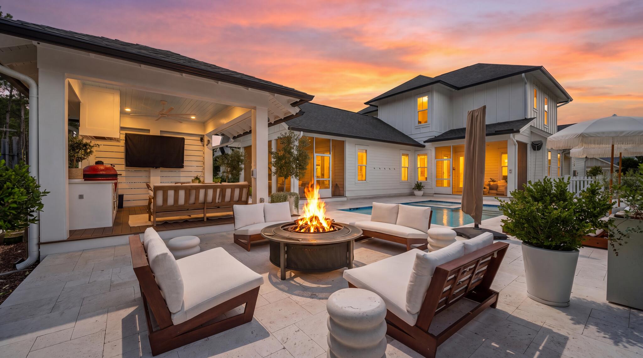 Welcome to 95 E Pollard Cove, an exceptional 4-bedroom, 5-bath home offering 3218 square feet of beautifully upgraded living space on a large corner lot in Inlet Beach. Thoughtfully designed for both everyday living and entertaining, this home pairs refined interior finishes with an impressive outdoor retreat and peaceful wooded views.

The backyard is truly one of the highlights of this property. Designed for year-round Florida living, the private outdoor retreat centers around a saltwater pool and hot tub surrounded by extended paver areas that provide generous space for lounging and entertaining. A dedicated fire pit area creates the perfect setting for evenings outdoors, while two screened porches allow you to enjoy the private wooded backdrop throughout the year. Two outdoor grilling areas include a cabana complete with refrigerator and an extra-large Kamado grill and 80'' google TV making this an exceptional space for everything from relaxed family weekends to entertaining a crowd. Upgraded landscaping, timed landscape lighting and irrigation complete the setting.

Inside, 10-foot ceilings, crown molding, coffered ceiling details, shiplap and custom feature walls bring character and architectural interest throughout the home. A striking wine wall and bar tucked beneath the staircase create a stylish entertaining space, while built-in ceiling speakers, custom closets and thoughtfully selected window treatments add both function and comfort. The kitchen serves as the heart of the home, featuring Thermador appliances, a 6-burner gas range, Bosch refrigerator and an oversized waterfall island with plenty of room for gathering.

A spacious drop zone provides an additional layer of everyday functionality with three built-in storage lockers, offering an organized space for bags, shoes and daily essentials. Electric blinds are featured in the primary bedroom, living room and dining room, complemented by custom blinds in the additional bedrooms and plantation shutters in the bathrooms.

Additional upgrades include gutters and gutter guards on both the home and cabana, an epoxy-finished garage floor.

From its thoughtfully upgraded interiors to an outdoor living space designed to be enjoyed year-round, 95 E Pollard Cove offers an exceptional combination of privacy, entertaining space and elevated coastal living in Inlet Beach.
