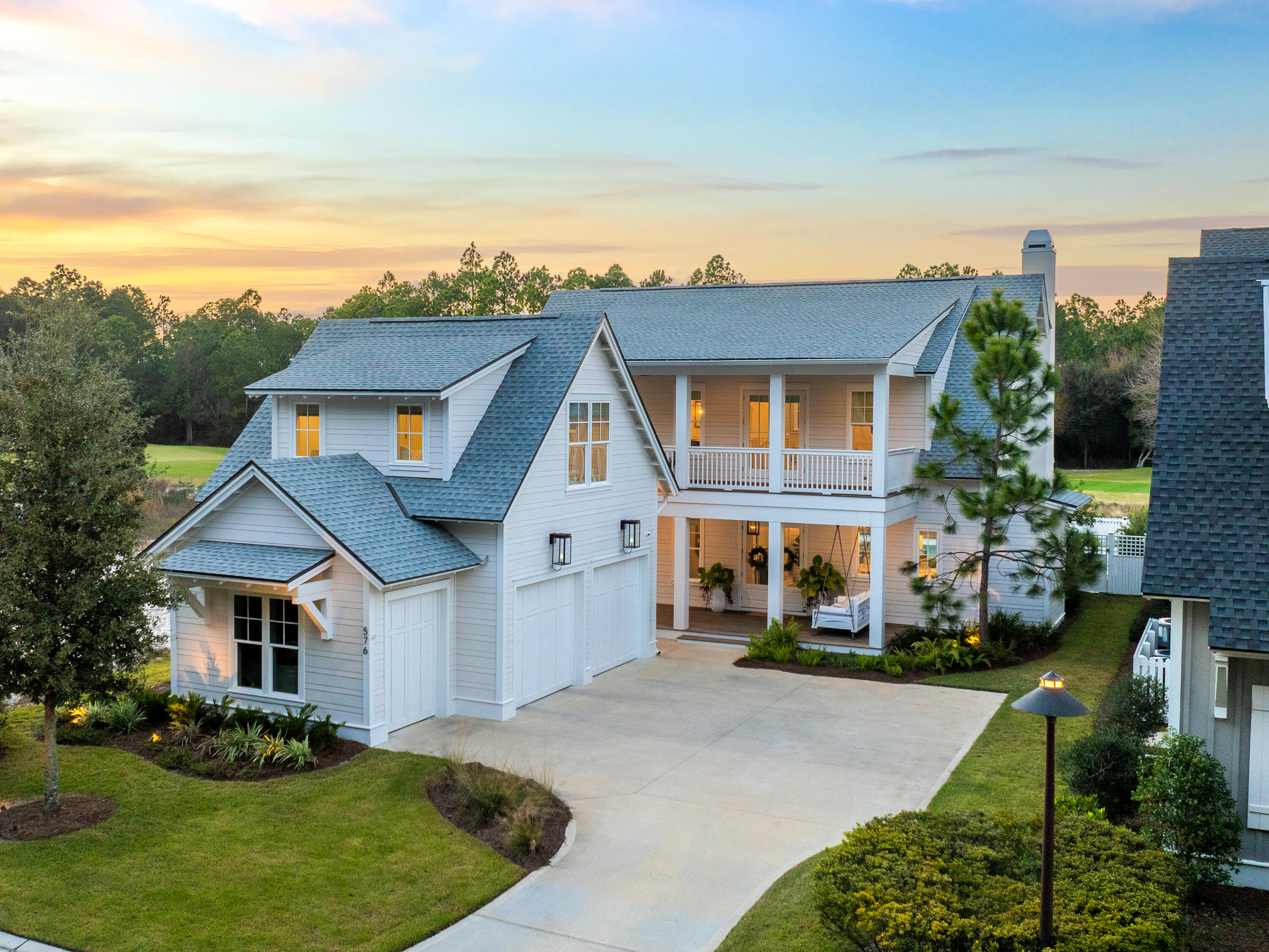 Positioned along the Watersound Origins Golf Course, this five-bedroom, five-and-a-half-bath residence captures one of the most peaceful perspectives in the community: wide fairway views framed by thoughtfully designed outdoor living spaces.

Inside, this Fairwater C plan was built around how people actually gather and spend time together. The kitchen anchors the main living area with a large marble island wrapped in white oak and equipped with Sub-Zero refrigeration, a dual Wolf range with both gas and electric cooking, and a built-in 30-inch Wolf coffee station. 

Just off the kitchen, a white oak wine bar introduces additional function with a wine cooler, nugget ice maker, and unlacquered brass fixtures that add warmth and character to the space. mind - Carrara marble bathrooms with custom tile, true masonry fireplaces (including a custom stone fireplace centering the main living room), wide-plank wood floors, a sliding glass wall opening to the lanai, custom stair runner, and California Closets in key bedrooms.
The outdoor living area was built to function as a true extension of the interior and to be used year-round. A private pool with raised hot tub sits off a covered lanai outfitted with automated screens, Cumaru hardwood decking, built-in electric heaters, integrated speakers, an outdoor kitchen with Artisan grill and refrigeration, and a second masonry fireplace.
A detached carriage house above the garage adds a fifth bedroom with its own full bath - ideal for guests, in-laws, or a long-stay home office, and the kind of layout flexibility most floor plans in this price band don't offer.
Behind the scenes, the home is set up to run cleanly. A 26-kilowatt Generac generator services the entire residence and carriage house. Sonos audio is wired throughout and controlled via dedicated iPads, Samsung Frame televisions are installed across multiple rooms, a full security system with day-night cameras is in place, and Wi-Fi-enabled garage doors include a dedicated golf cart bay. Outside, extensive landscaping, low-voltage lighting, and a Wi-Fi irrigation system frame the home and golf course setting.
Watersound Origins remains the most practical community on this side of 30A for full-time residents - close to the Origins Club, walking trails, the Watersound Town Center, Publix, and zoned to South Walton schools.
Most homes in Origins have one or two standout features. This one combines several: real golf course frontage, a fully built-out outdoor living space, a detached carriage house, and a depth of systems already paid for and installed. For a buyer weighing this against starting fresh, the math and the timeline both favor the home that's already done.