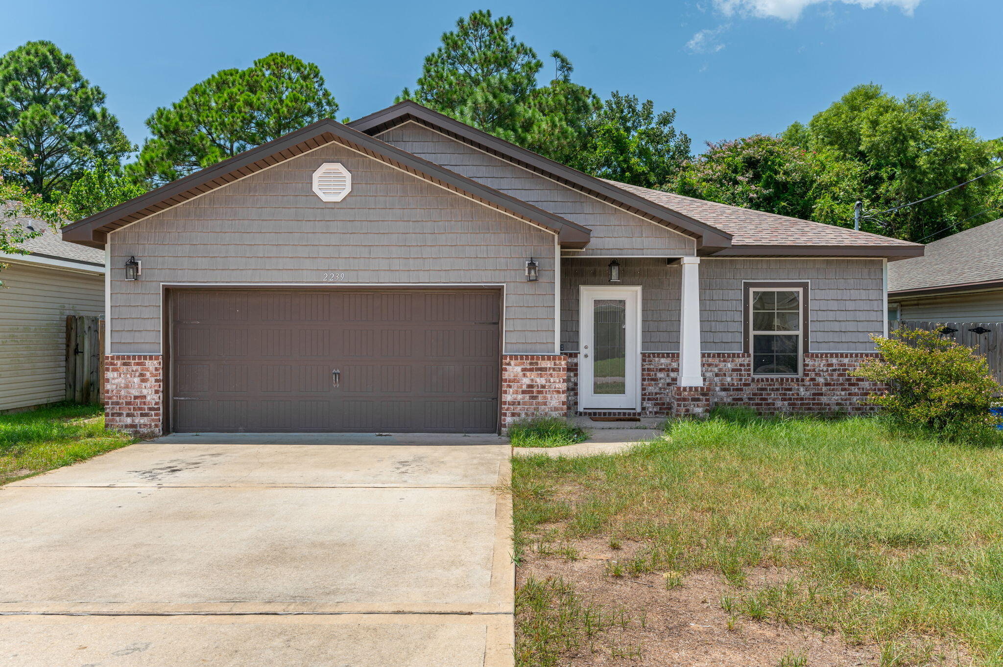 elcome to 2239 Tom Street, a beautifully maintained 4-bedroom, 3-bath home in Navarre, ideally located for military families and those working on the Emerald Coast. Built in 2018 with 1,829 sq. ft., this Craftsman-style home features an open floor plan, granite countertops, breakfast bar, spacious primary suite with two walk-in closets, double vanity, garden tub and separate shower. The covered back porch and fenced backyard provide a great space to relax or entertain, while the 2-car garage offers added convenience. Military families will appreciate the convenient location with easy access to Hurlburt Field and Eglin Air Force Base, making the daily commute more manageable. Nearby schools, grocery stores, restaurants and shopping add to the convenience, with Publix, Walmart, ALDI and Navarre's shopping centers just minutes away. Plus, Navarre Beach and the Gulf Coast are close enough to enjoy on your days off. This home combines comfort, convenience and an excellent location for military life on the Emerald Coast!
 The back yard is fenced and we are accepting pets on a case-by-case basis!