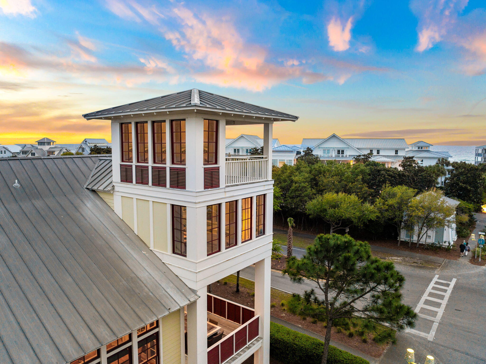 Located in the heart of WaterColor, this corner-lot residence offers multiple porches and Gulf views from its four-story watchtower. Positioned directly across from the WaterColor Beach Club and just steps from Seaside, the home spans more than 5,000 square feet and includes seven bedrooms, a private pool, and a carriage house.

The main living and dining areas occupy the second floor, offering privacy and abundant natural light. The living room features soaring ceilings and French doors that open to generous covered porches, creating seamless indoor-outdoor flow. A formal dining area and additional sitting spaces add flexibility, while the kitchen is outfitted with premium appliances, ample cabinetry, and bar seating.

Accommodations include suites on every floor and in the carriage house, plus a built-in bunk room. The private pool sits between the main house and carriage house, complemented by a wood-burning fireplace and outdoor kitchen. A spacious mudroom offers custom built-ins, two sets of washers and dryers, and a changing room for easy pool and beach access. 

Recent updates include an additional third-floor bathroom, refreshed flooring, and upgraded lighting, along with a central vacuum system and floor-to-ceiling impact glass windows throughout. WaterColor, Florida is one of 30A's most sought-after communities. Miles of walking and biking trails wind through lush coastal forests, connecting neighborhoods to parks, pools, Western Lake, the Town Center, and the beach. Residents enjoy multiple community pools - including the expansive Camp WaterColor and the iconic WaterColor Beach Club with Gulf views and beach access -- plus kayaking and paddle boarding on Western Lake via the BoatHouse. Beautiful gathering spaces such as Cerulean Park, Marina Park, and Western Lake Park round out the community, along with a fitness center, tennis and pickleball courts, and a town center just minutes from the dining and entertainment along Scenic 30A.

Inquire today to schedule a private showing and experience all that WaterColor has to offer.